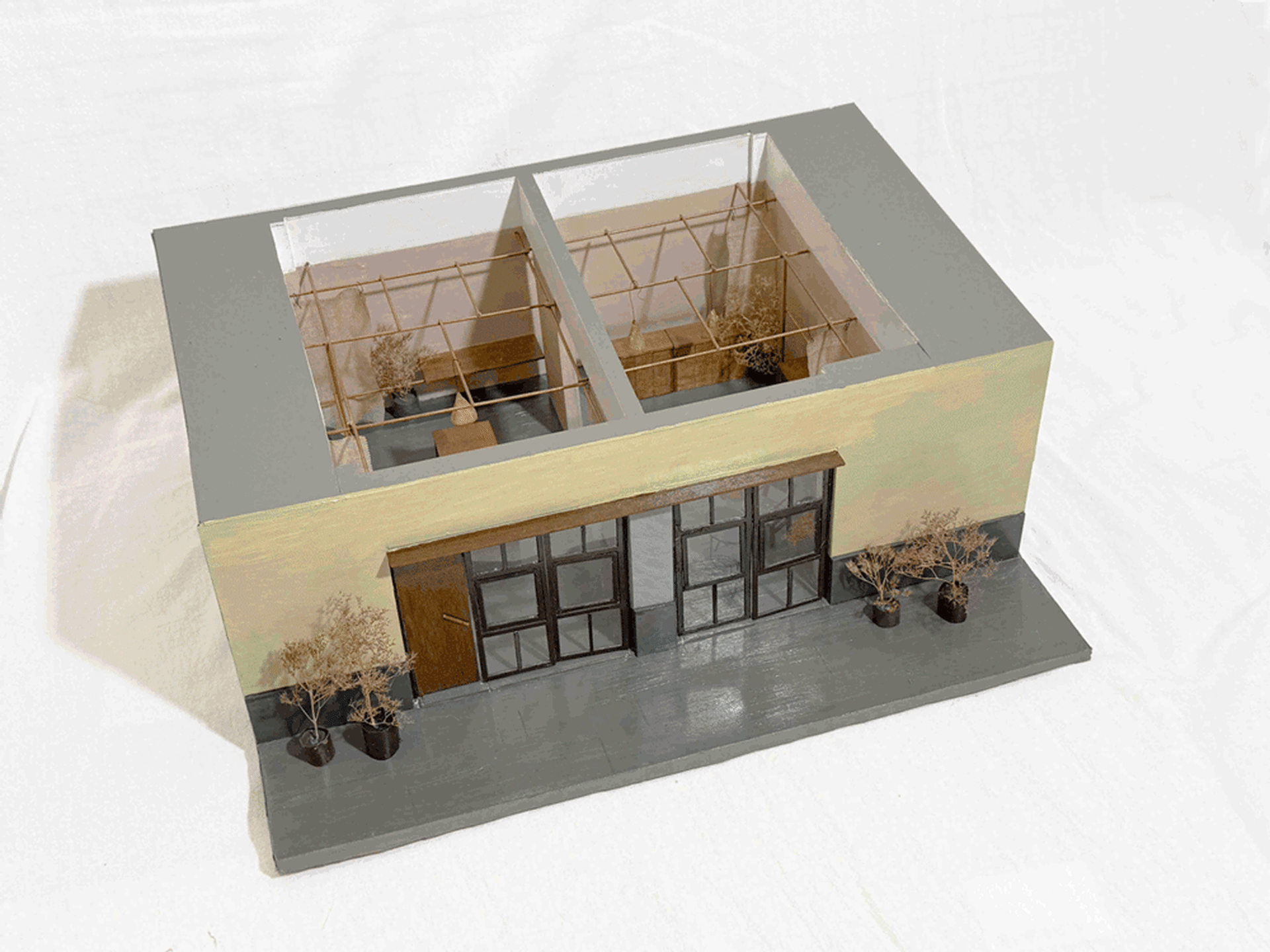 A detailed model of an industrial storefront with a metal frame and glass doors.