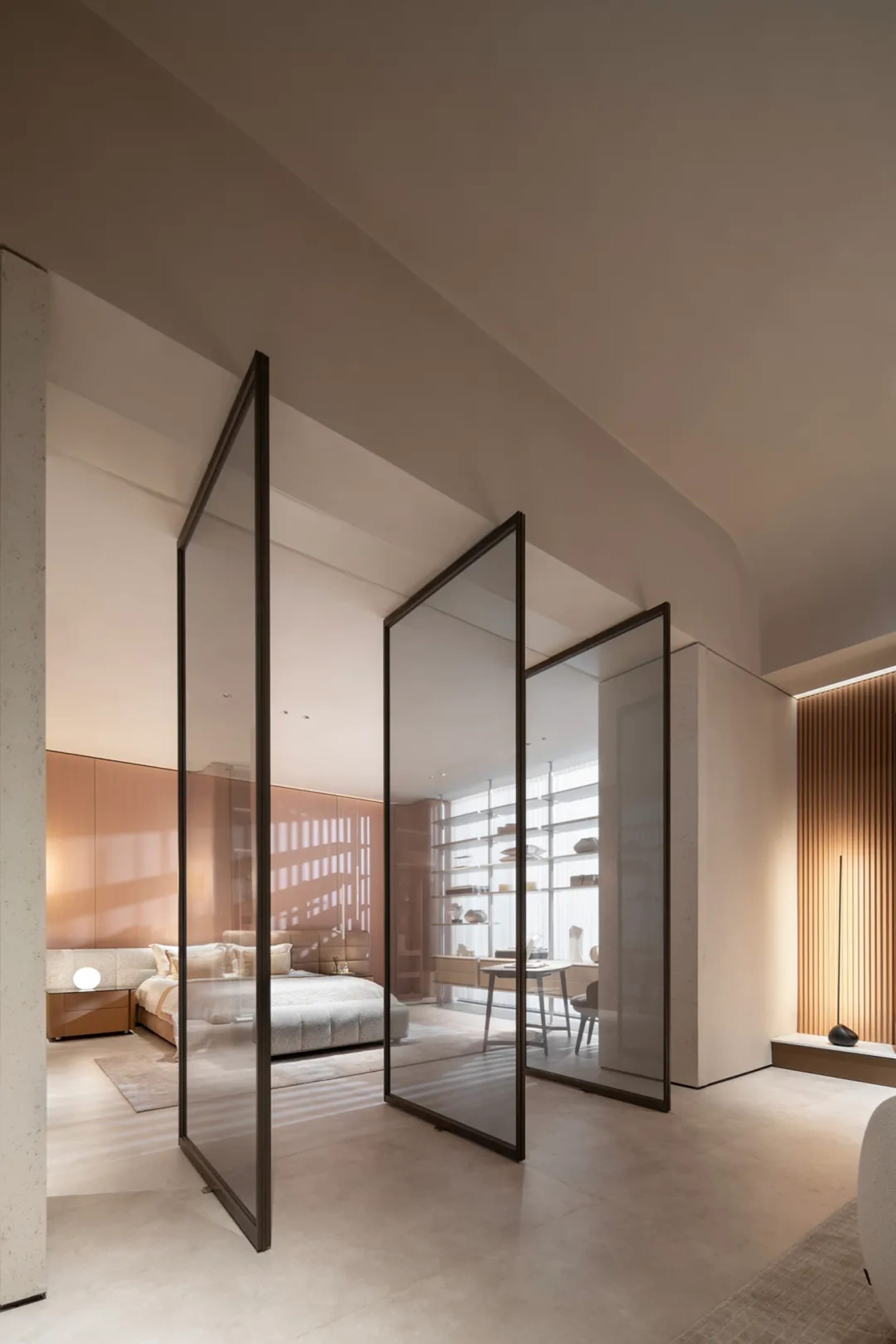 Modern bedroom with glass walls and concrete floors