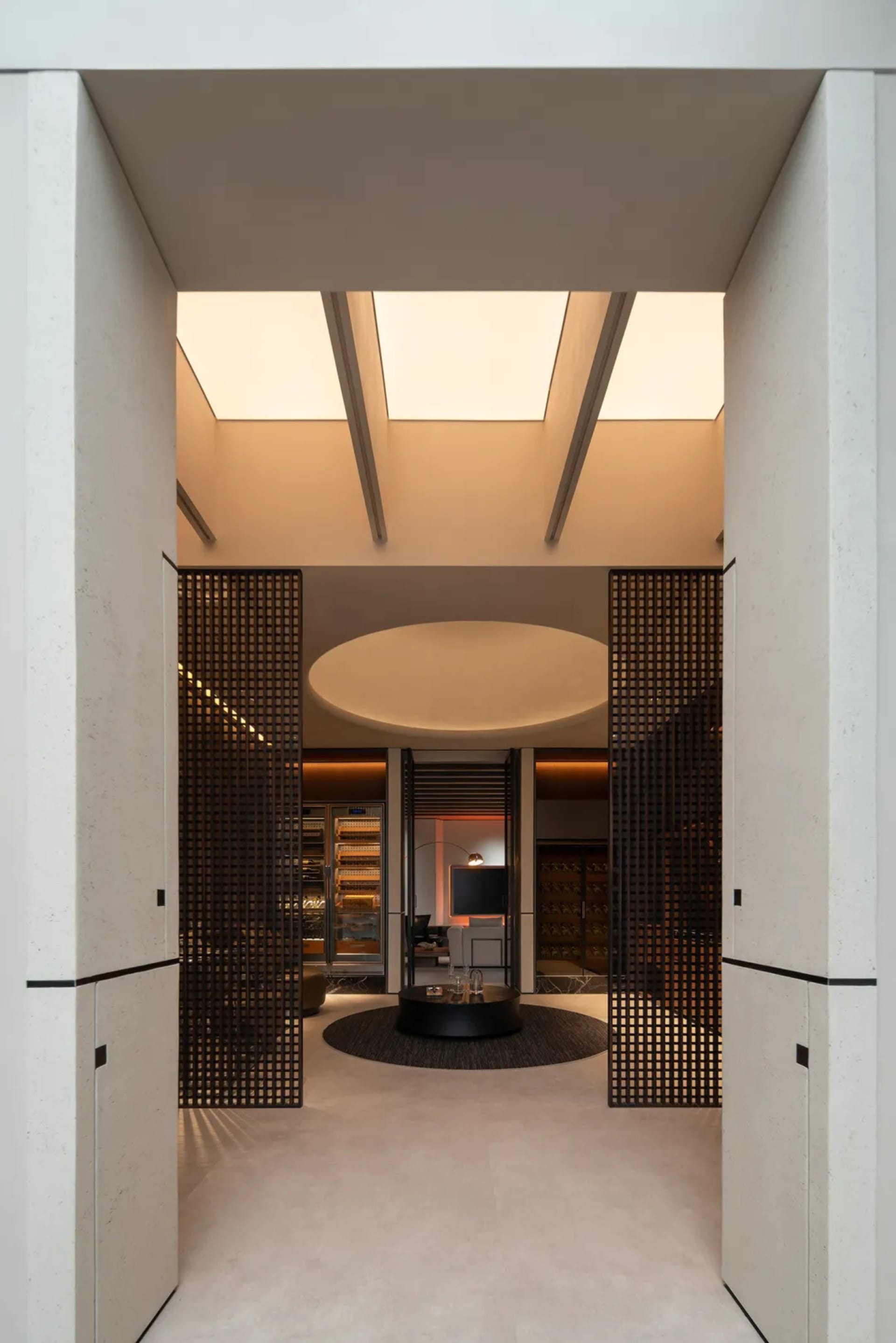 A modern wine cellar with wooden elements, located indoors.