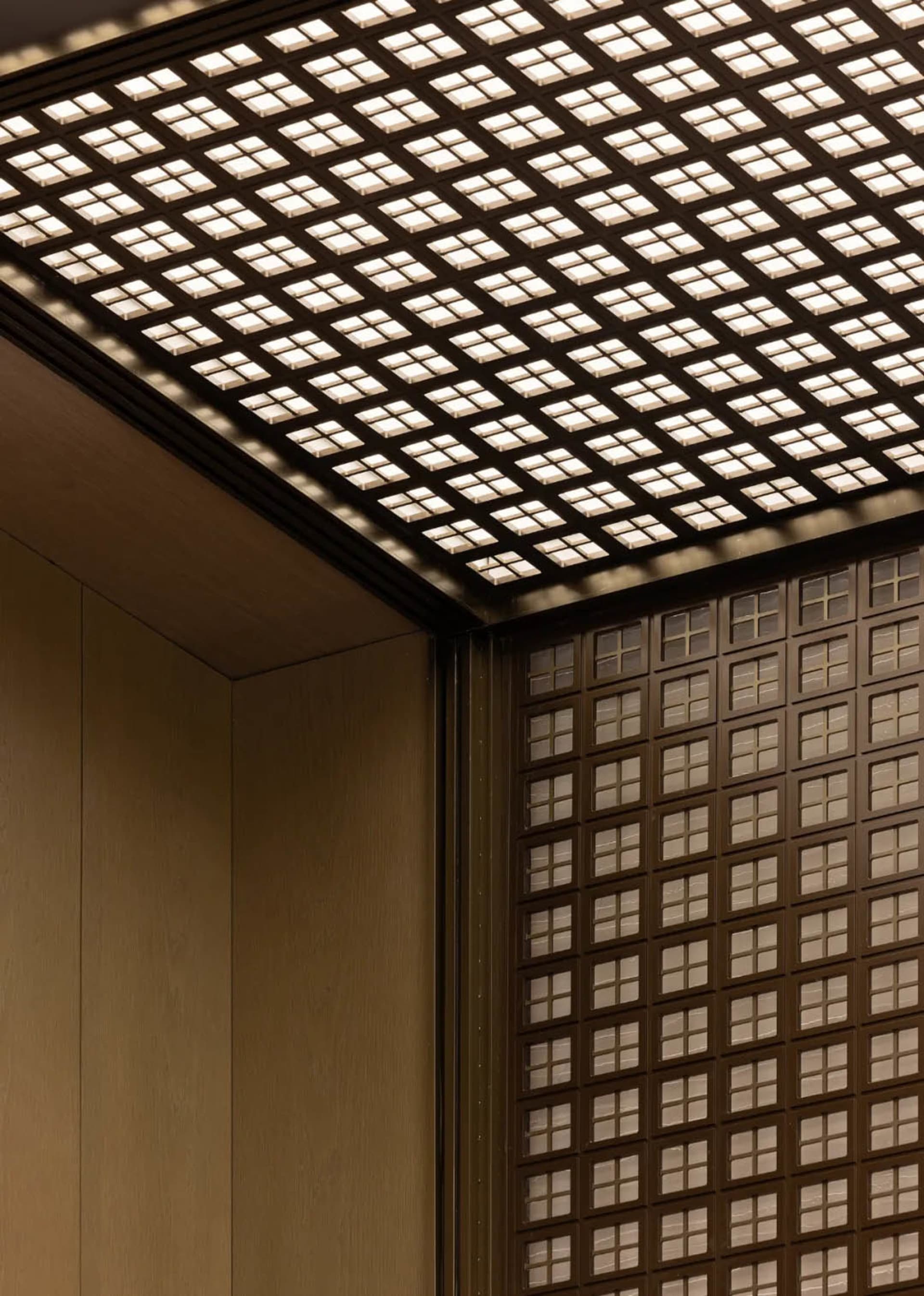 Metallic glass paneling in an industrial interior space
