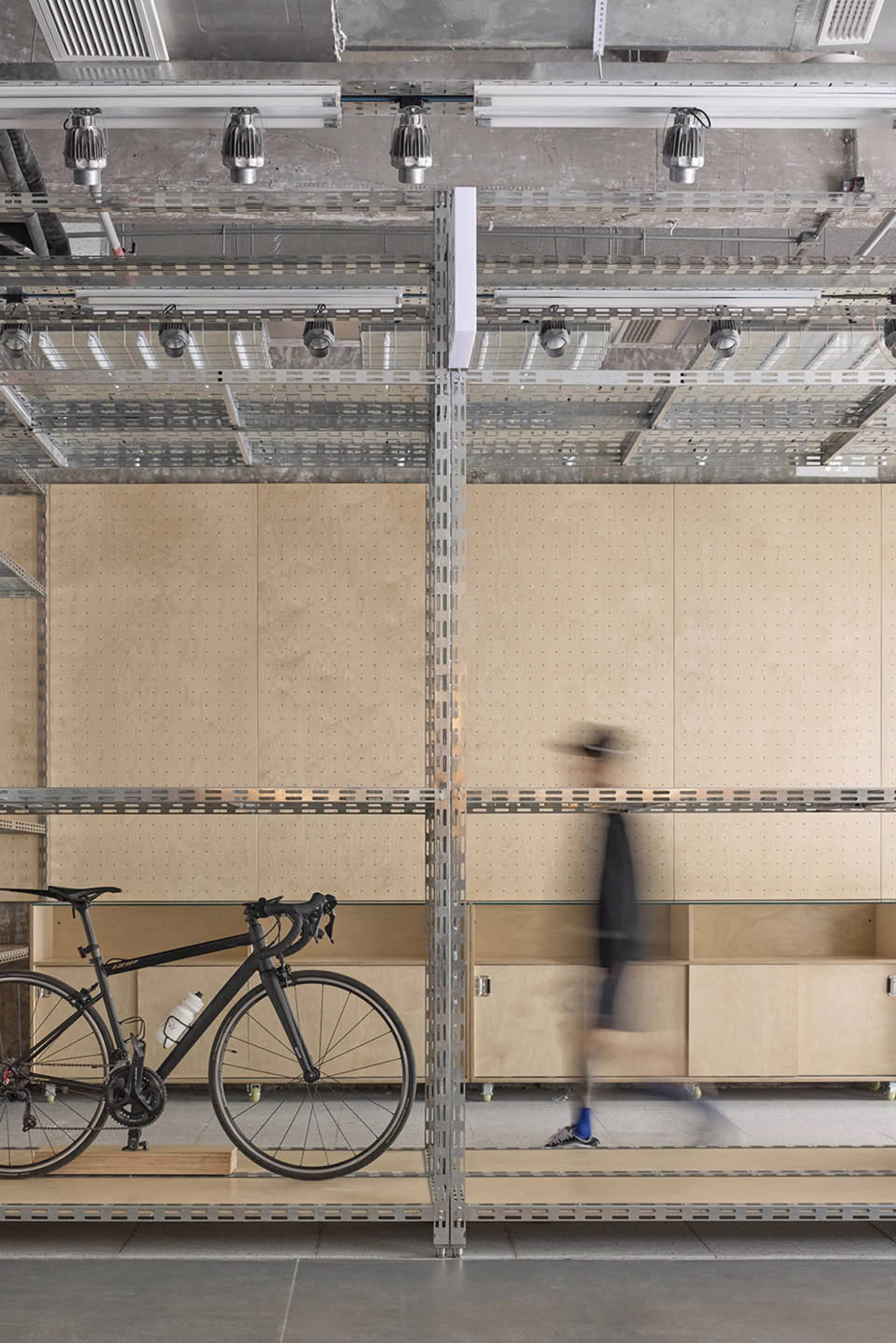 A minimalist interior space featuring metallic shelving.