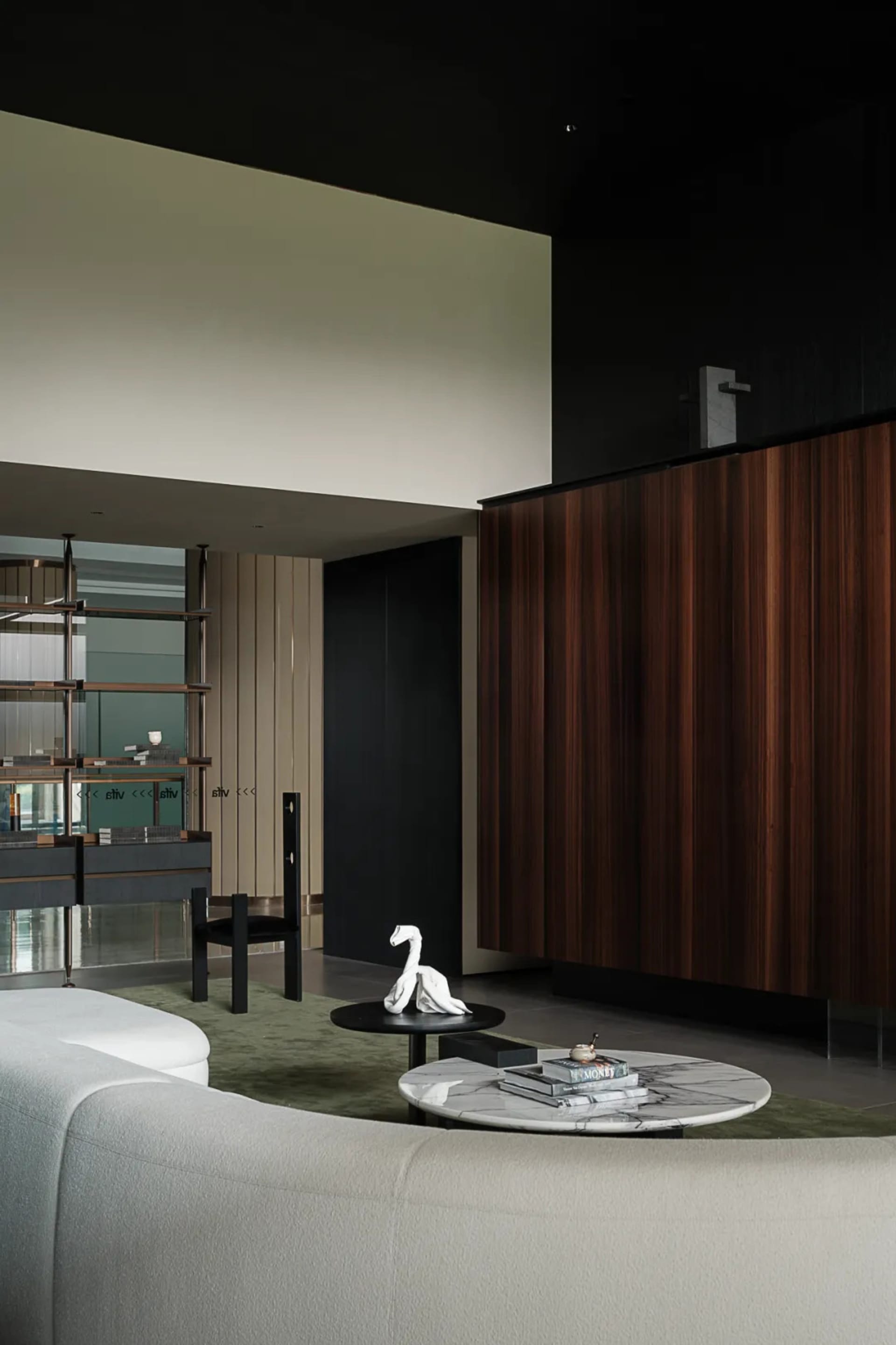 A stylish modern minimalist living room featuring clean lines, wood and marble finishes, and a comfortable fabric sofa.