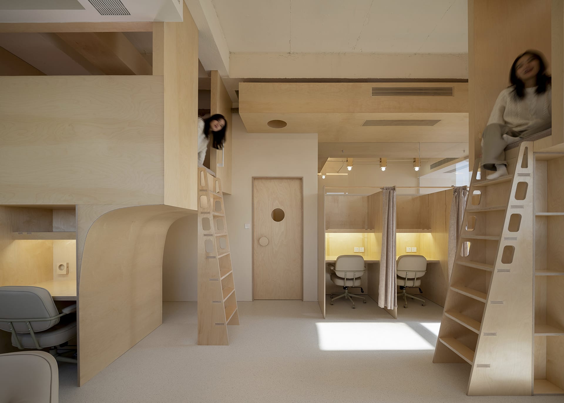 A minimalist office space with wooden furniture and walls.