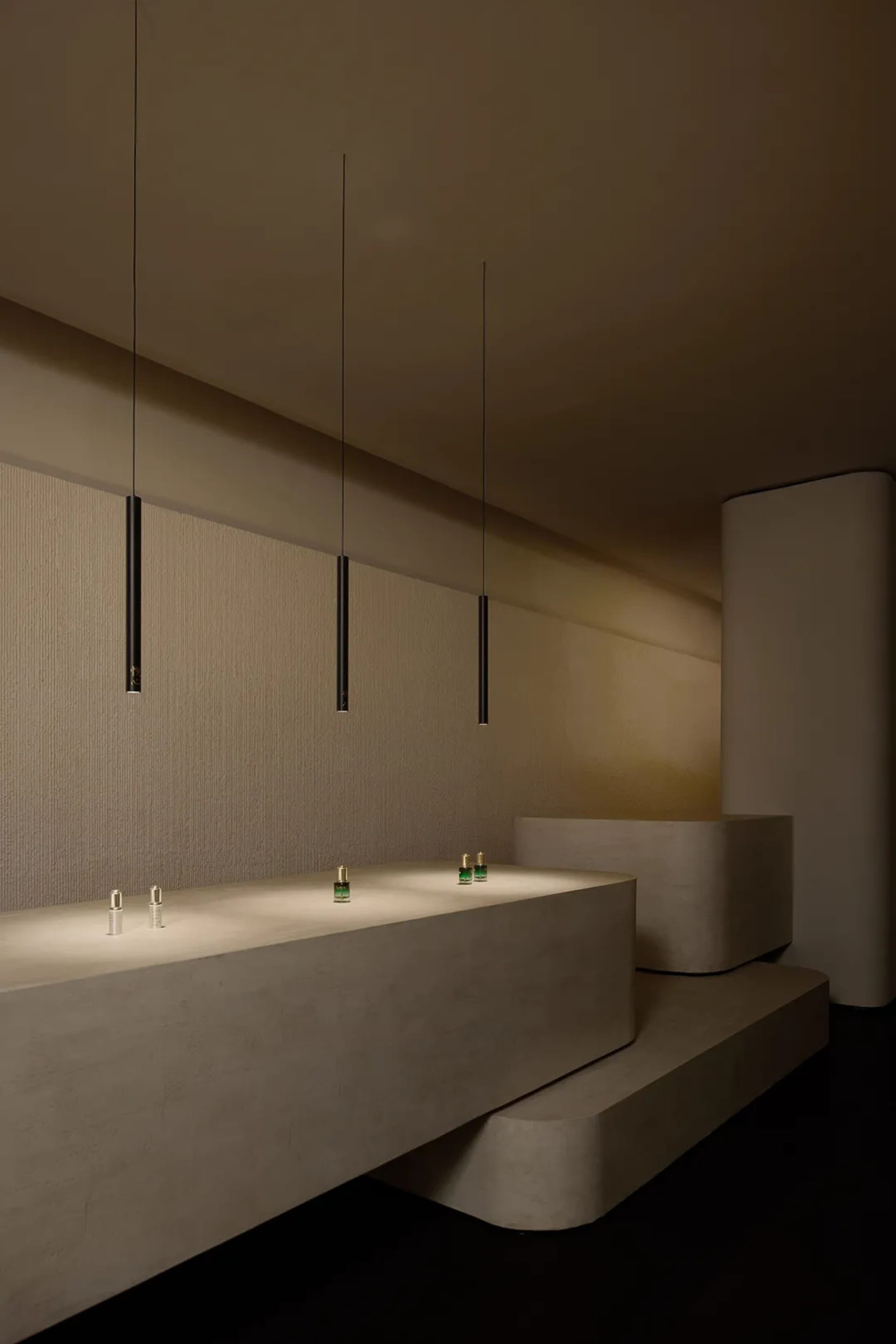 Modern retail storefront showcasing minimalist design and concrete elements.