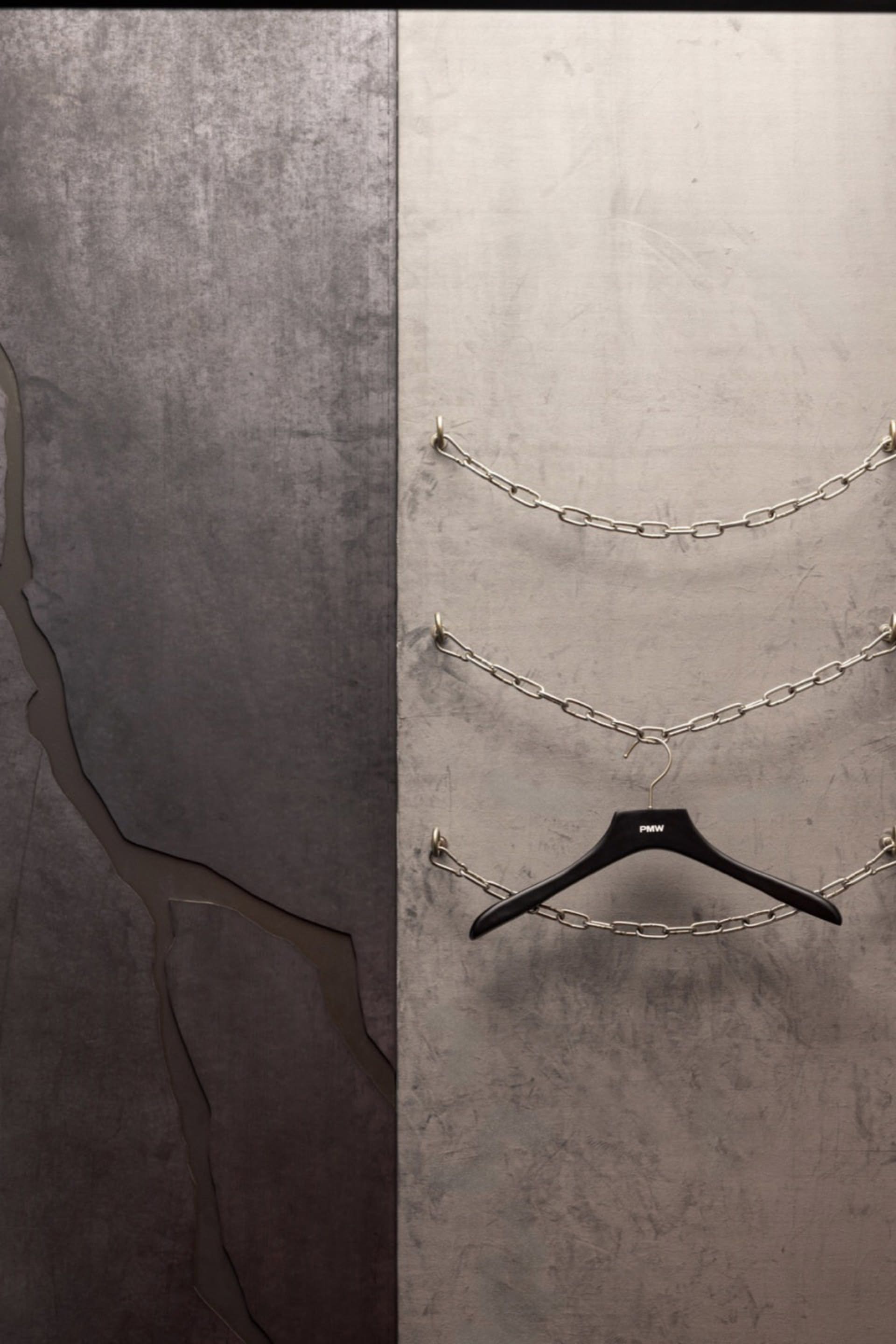 An industrial-style art installation featuring metal chains