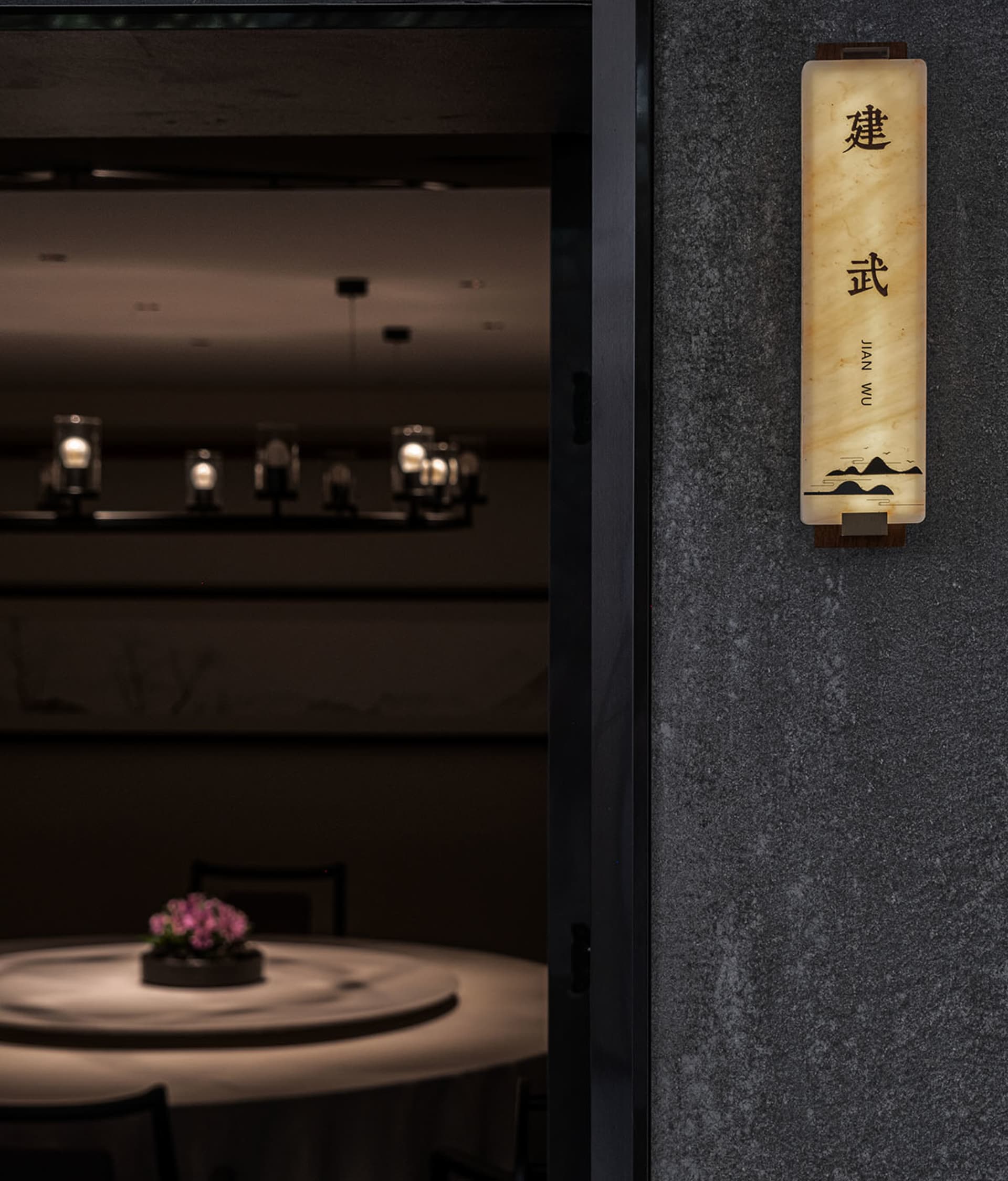 Marble restaurant interior with elegant lighting and signage