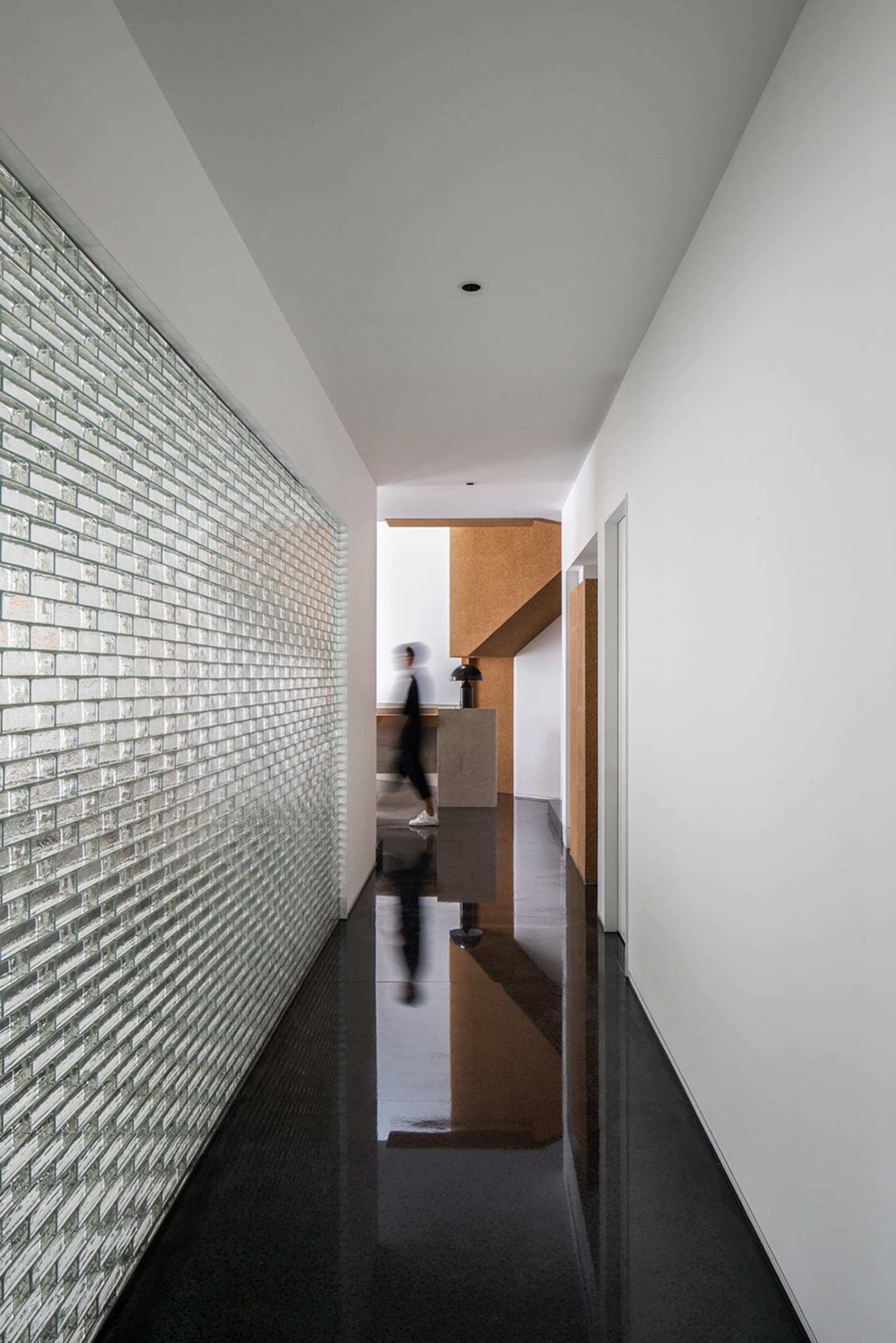 A modern interior design space featuring a glass wall.