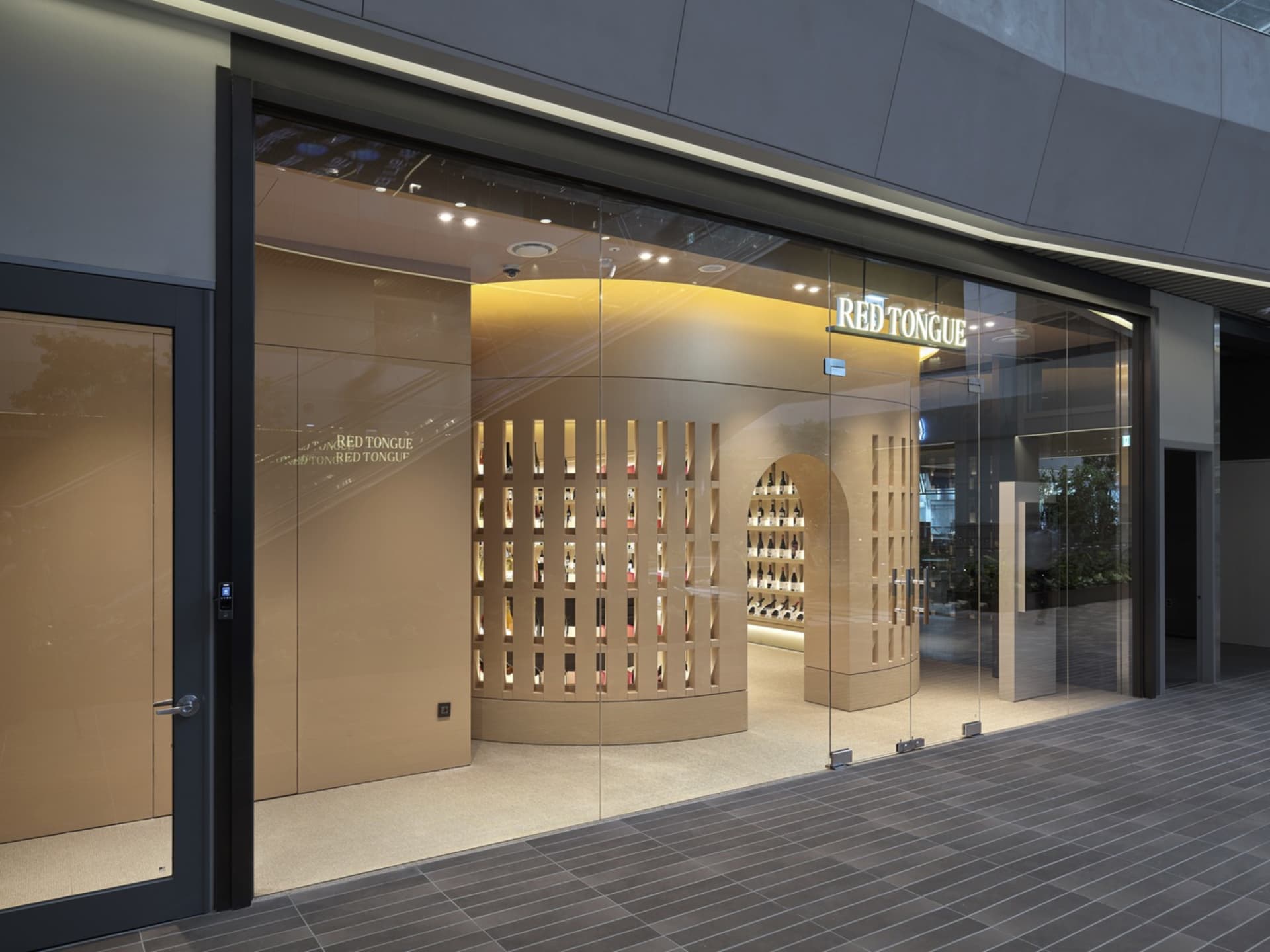 Modern storefront with glass entrance and display window.