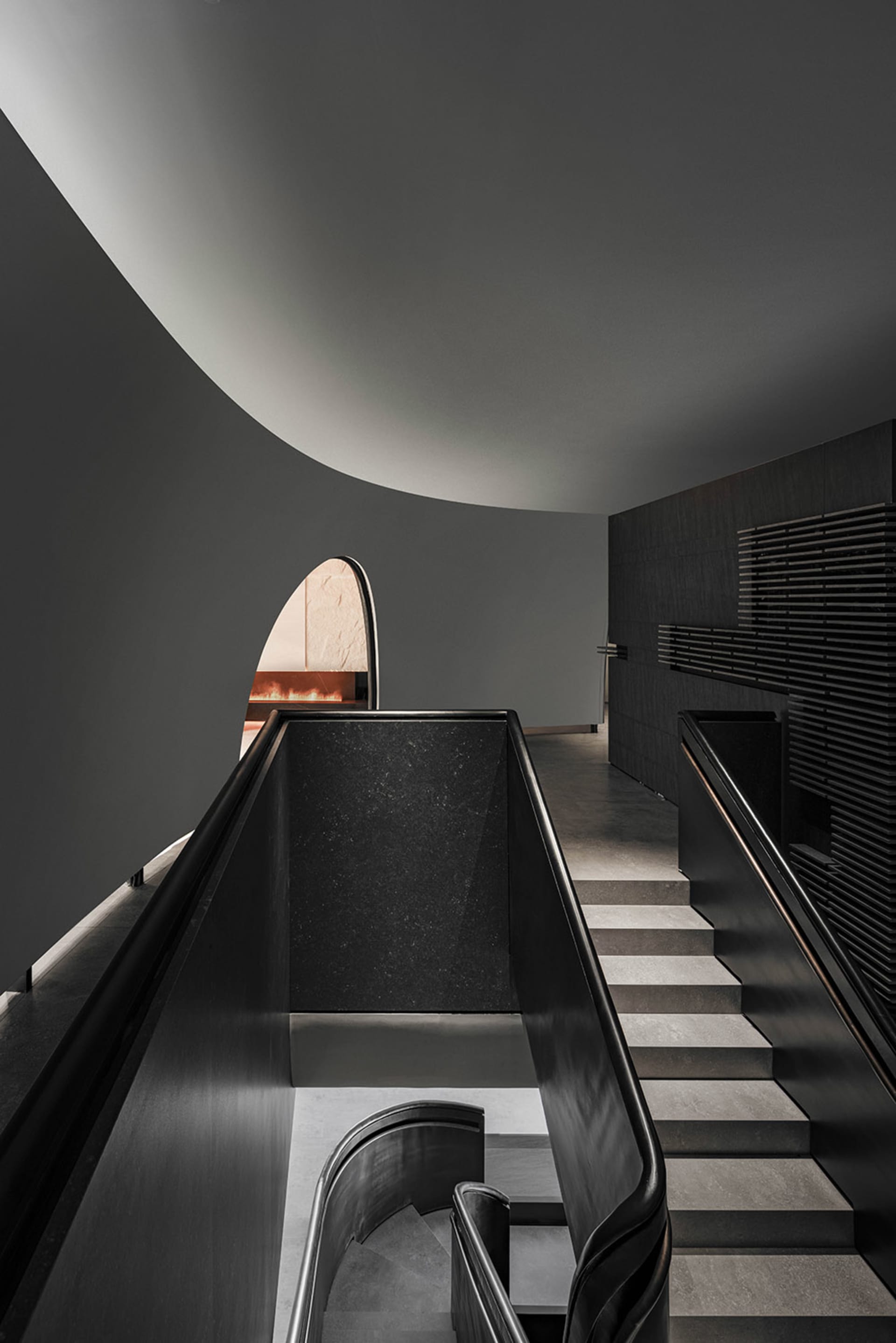 Modern interior design featuring black metallic stairs and escalator.