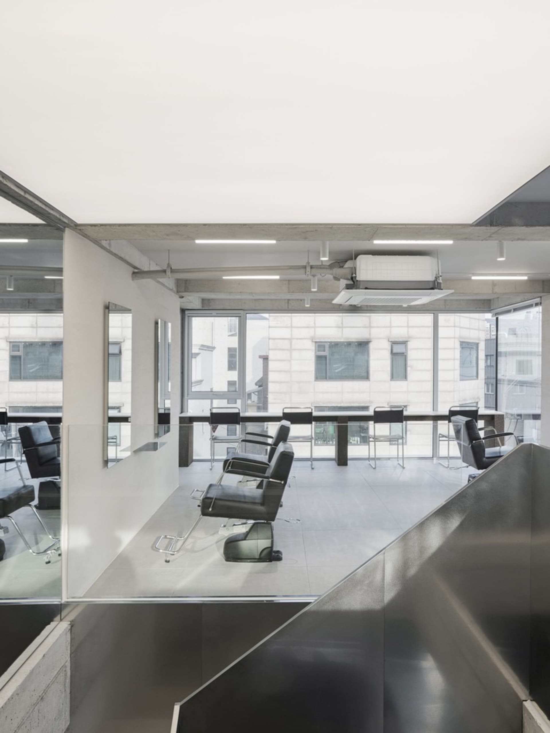 A modern hair salon interior with metallic accents.
