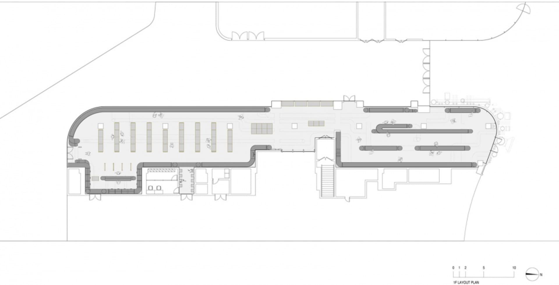 Linear office layout with designated spaces for workstations and common areas.