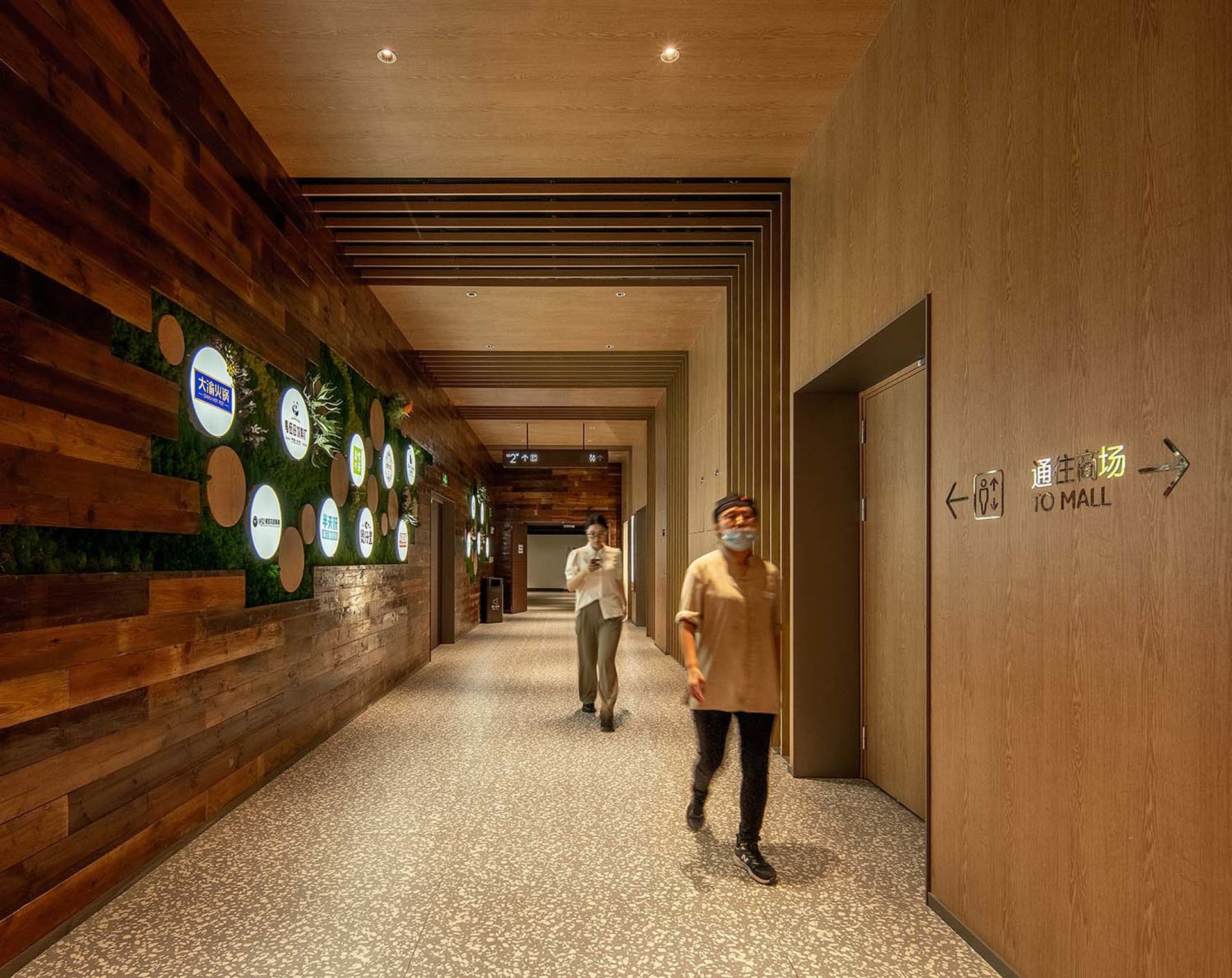 A spacious, industrial-themed commercial interior with wood accents and modern fixtures.
