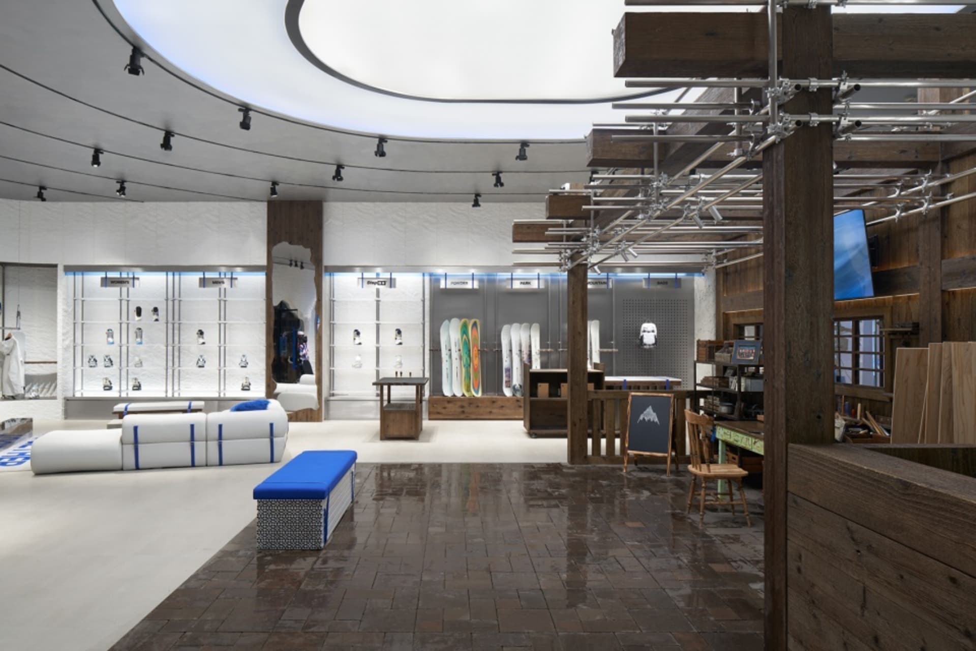 Retail storefront featuring industrial design elements with concrete and wood materials.
