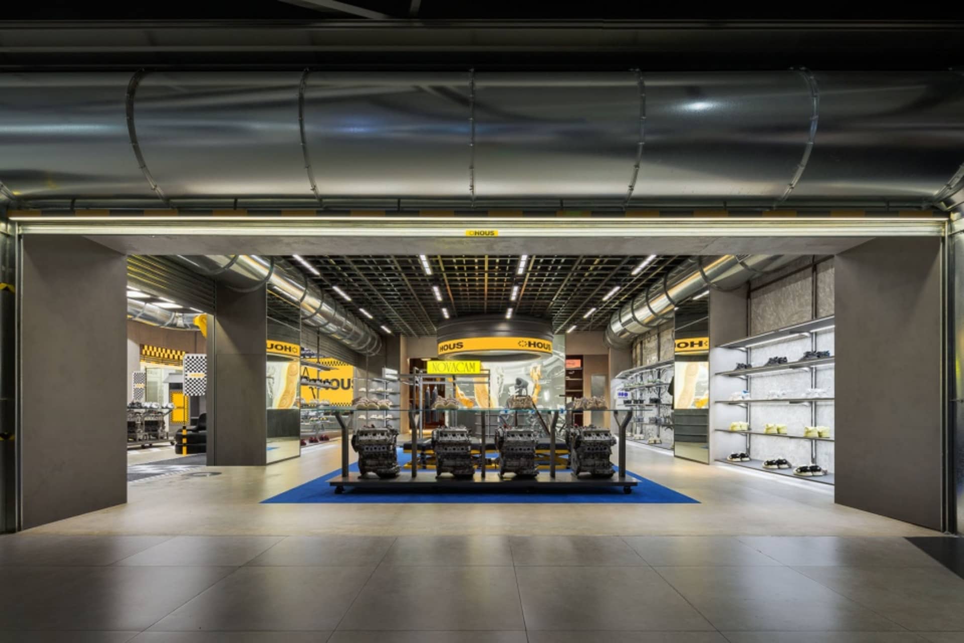 A showroom featuring industrial storefront metal and concrete elements.