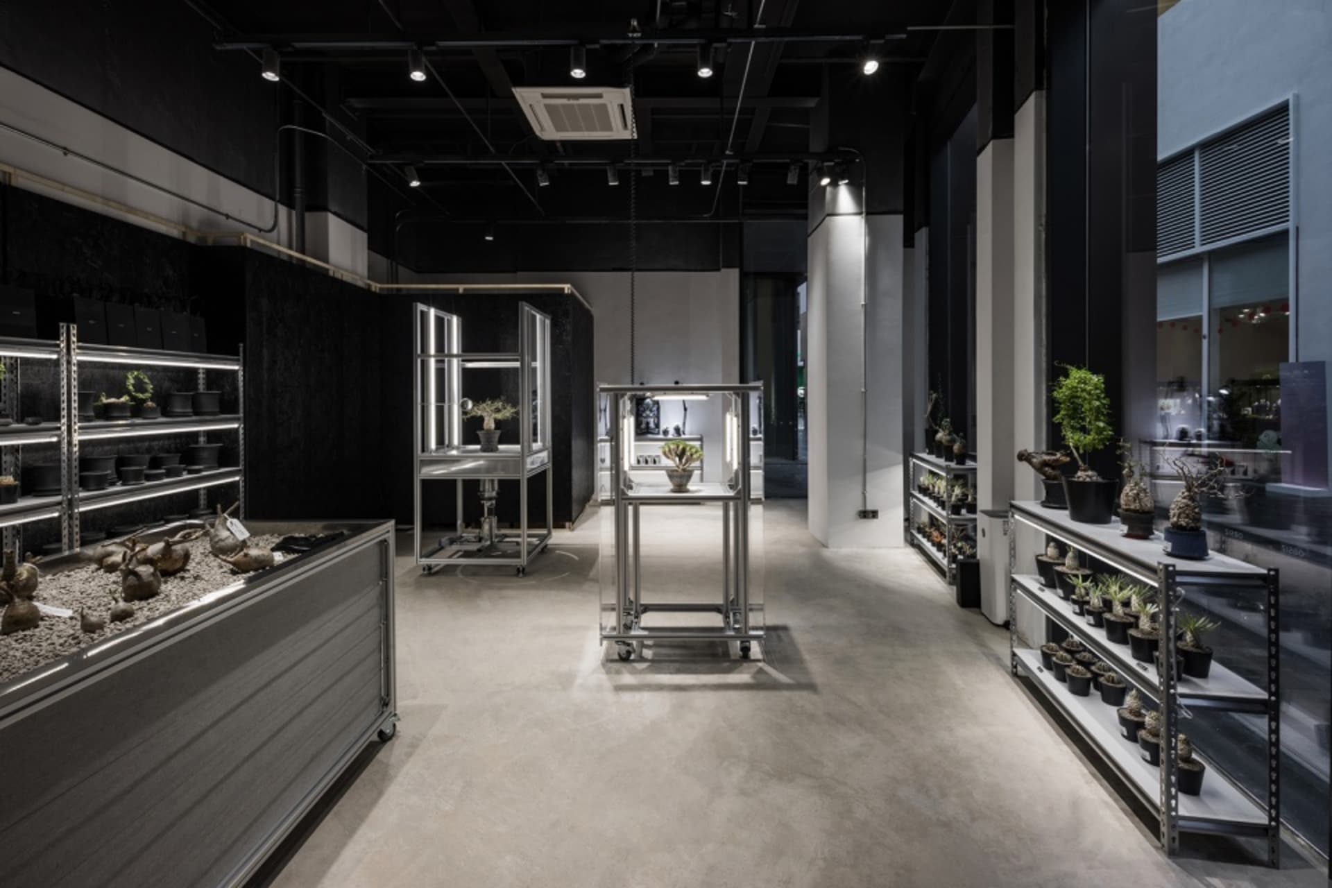Industrial-themed retail store with metal shelving and display cases