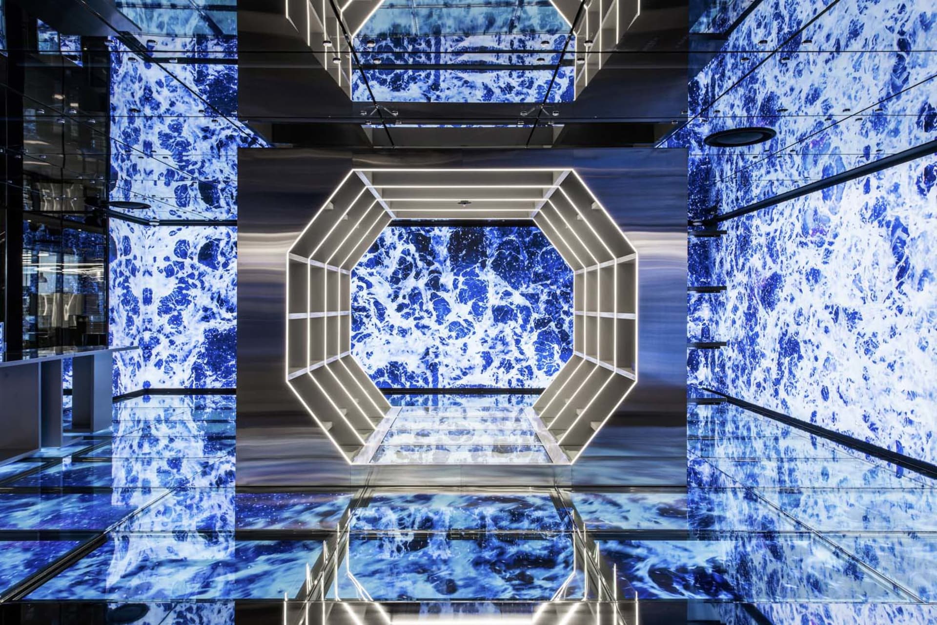 A modern commercial space featuring blue stone and metallic elements.