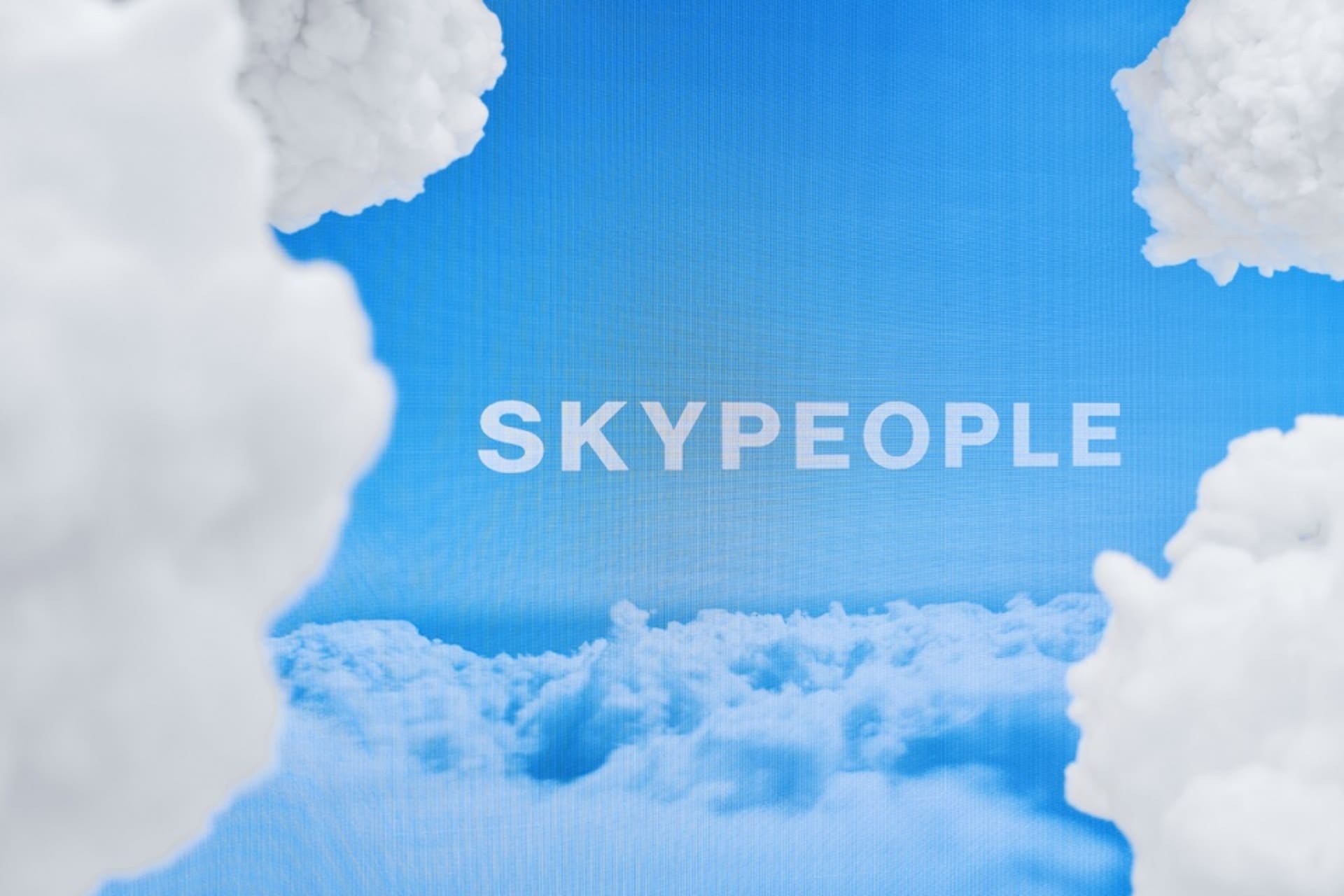 White fluffy clouds against a blue sky background