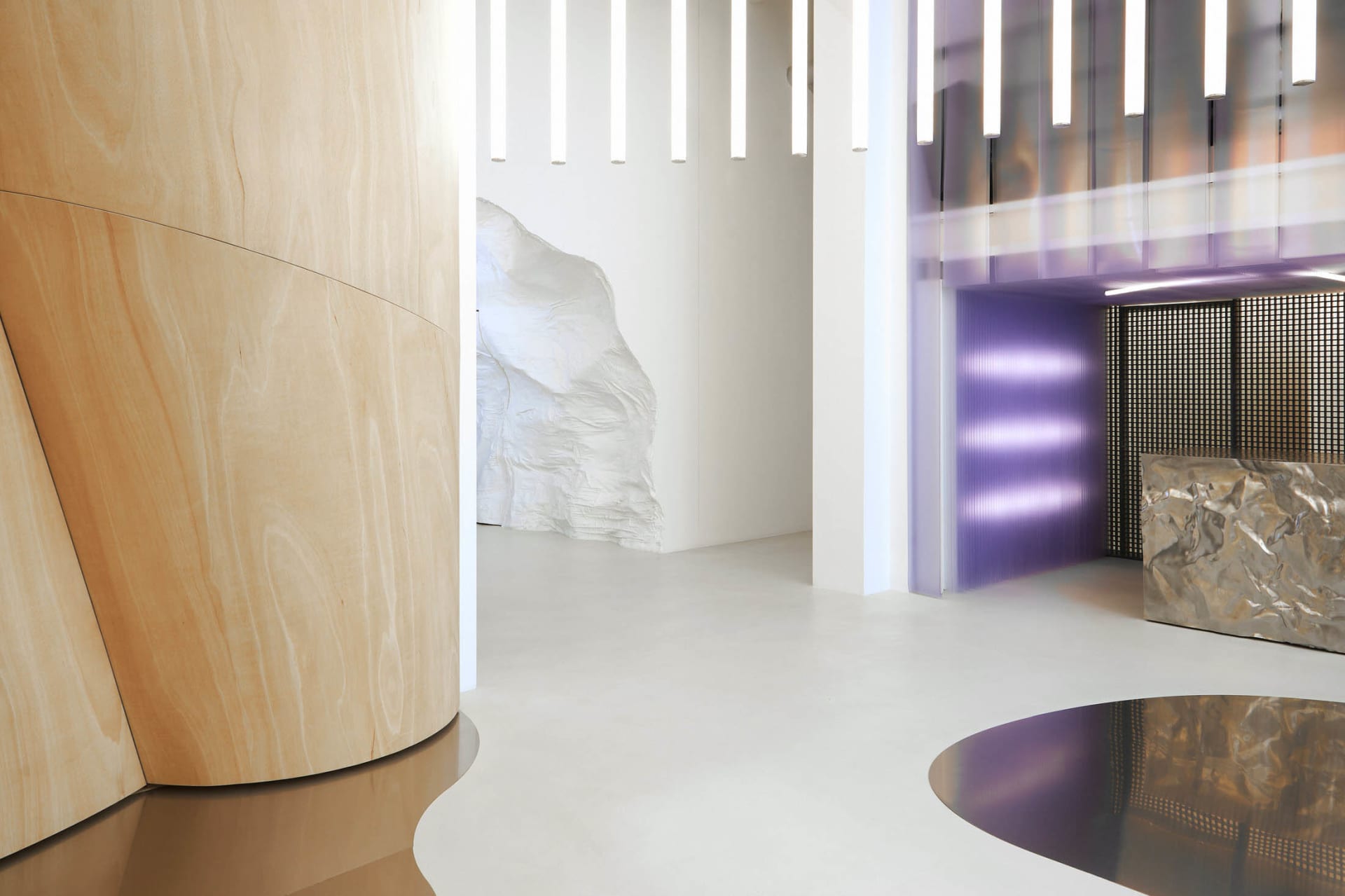 Metallic wall panel featuring textured surface and geometric design in a contemporary interior setting.