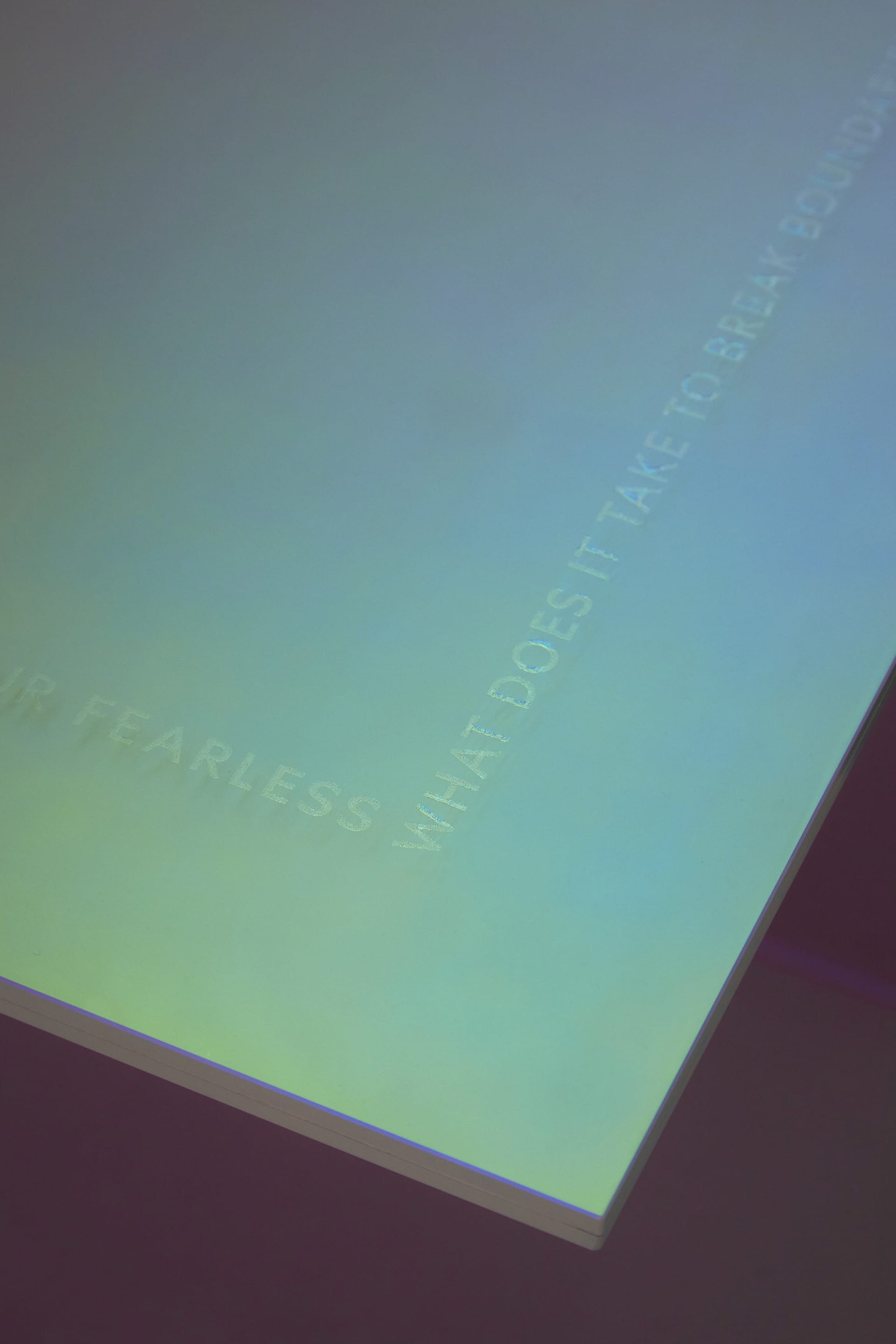 A minimalist display featuring matte black signage.