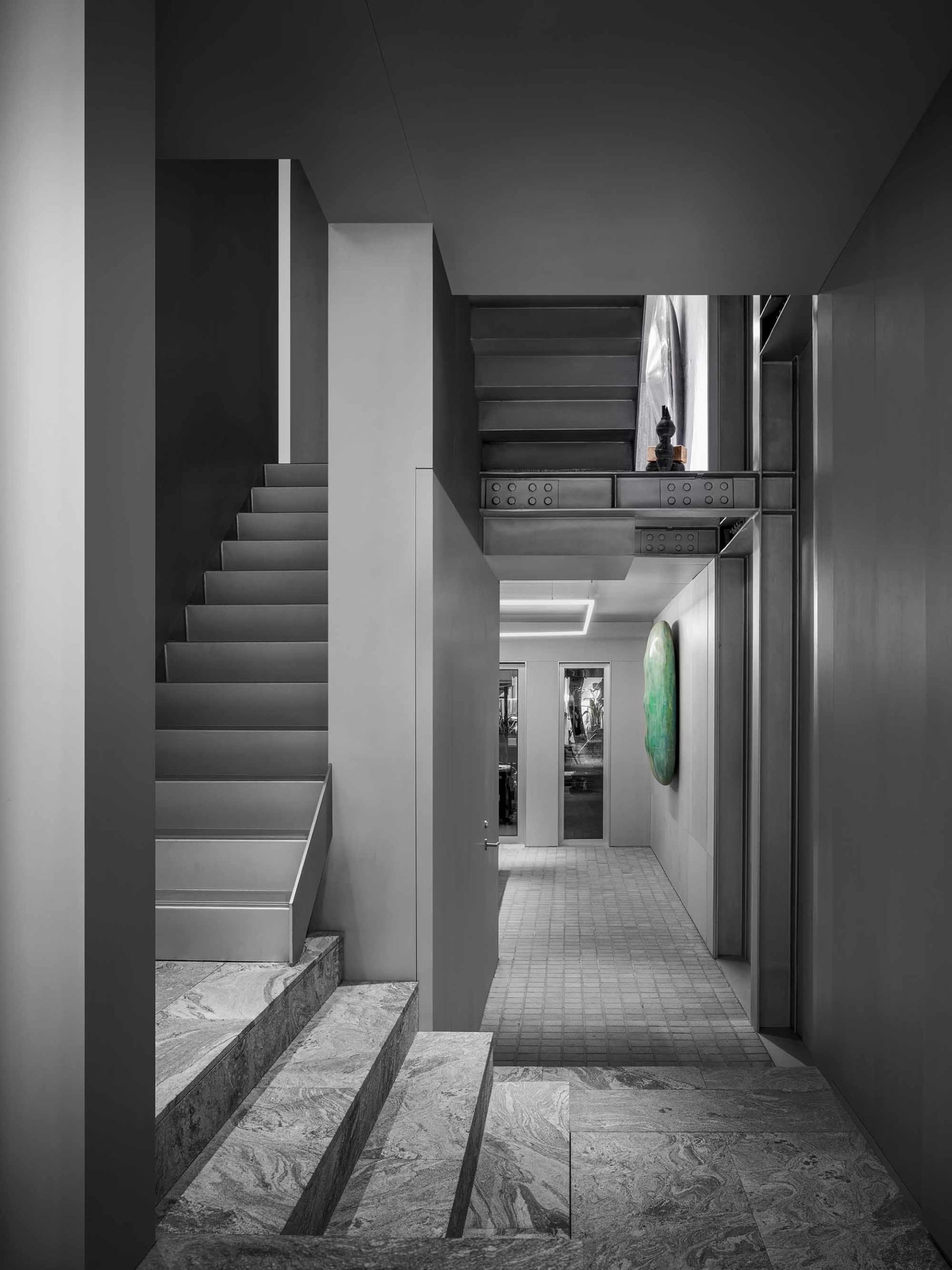 Modern interior featuring marble stairs with minimalist design elements.