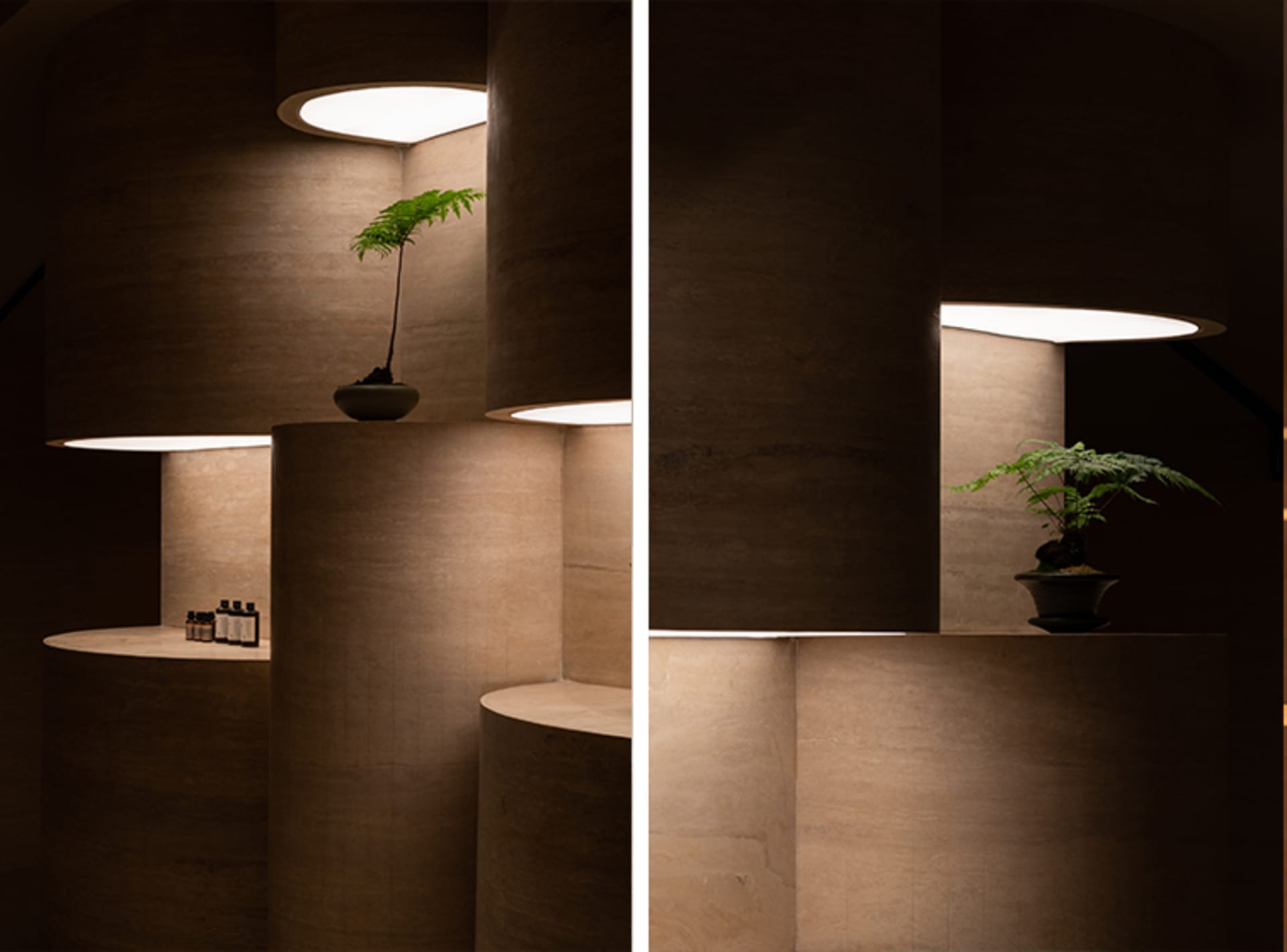 Modern interior design featuring a concrete structure with illuminated lighting and a plant display.