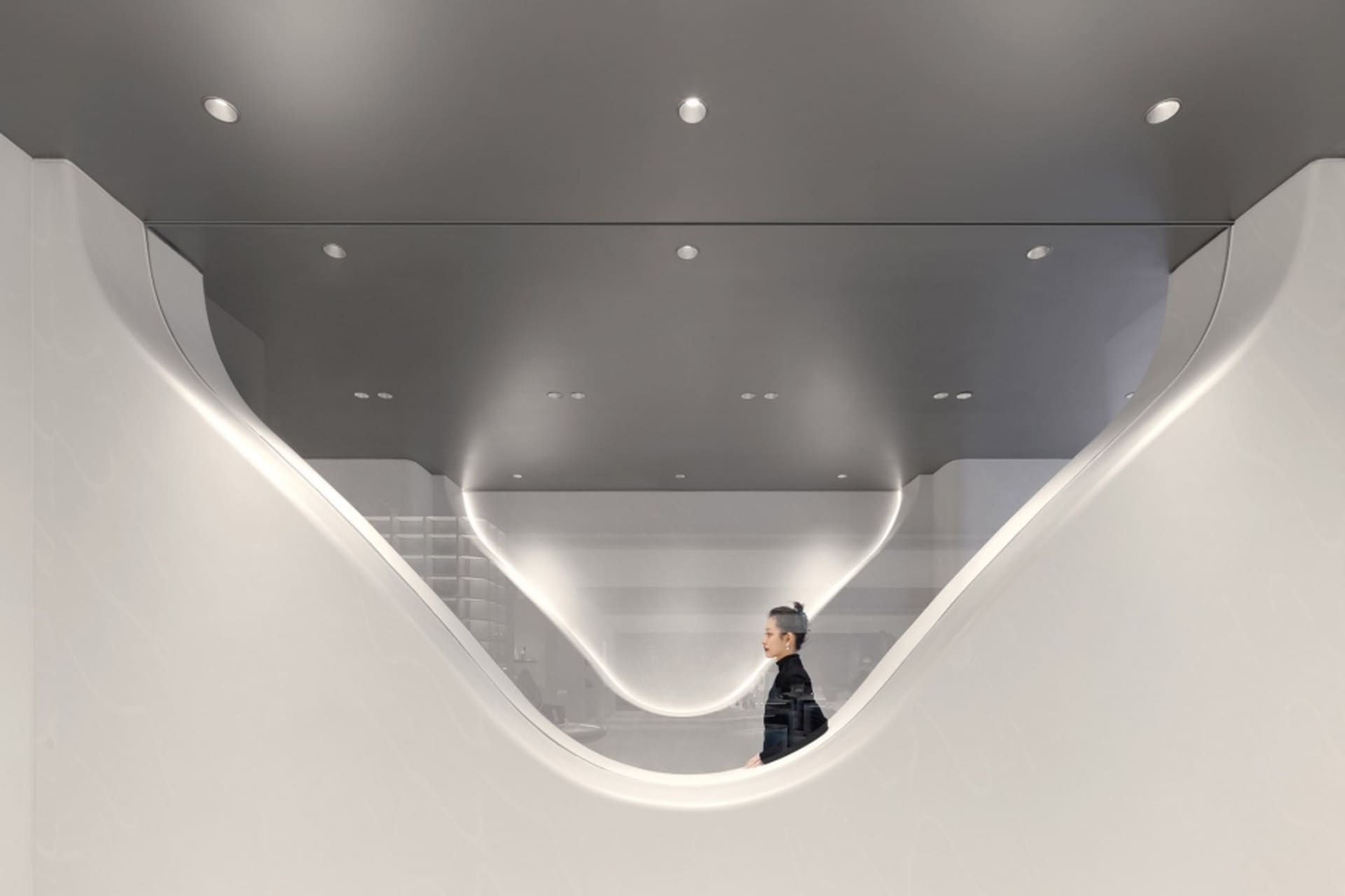 A modern interior space featuring glass and metal materials.
