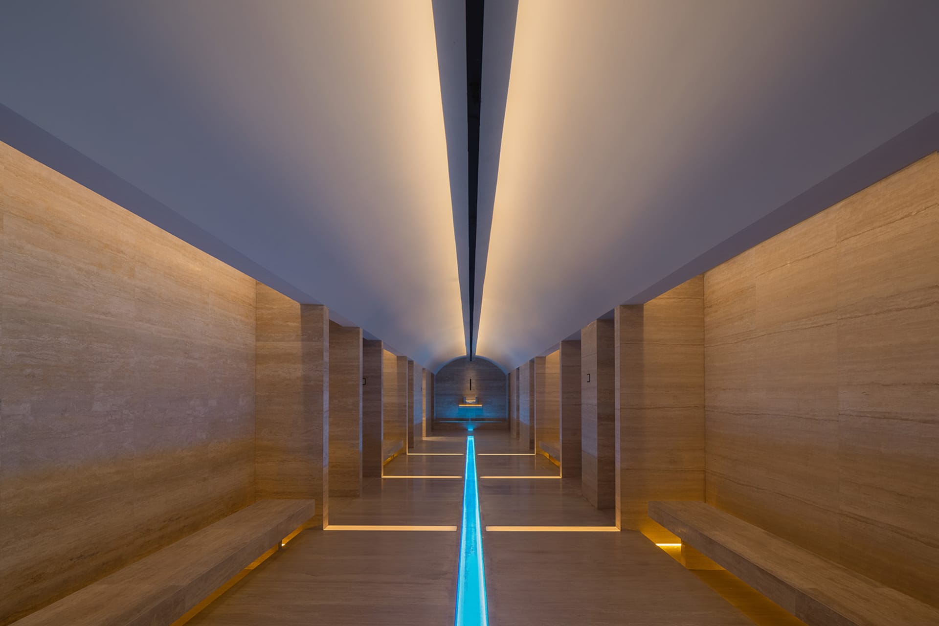 A modern lobby features minimalist concrete design elements.