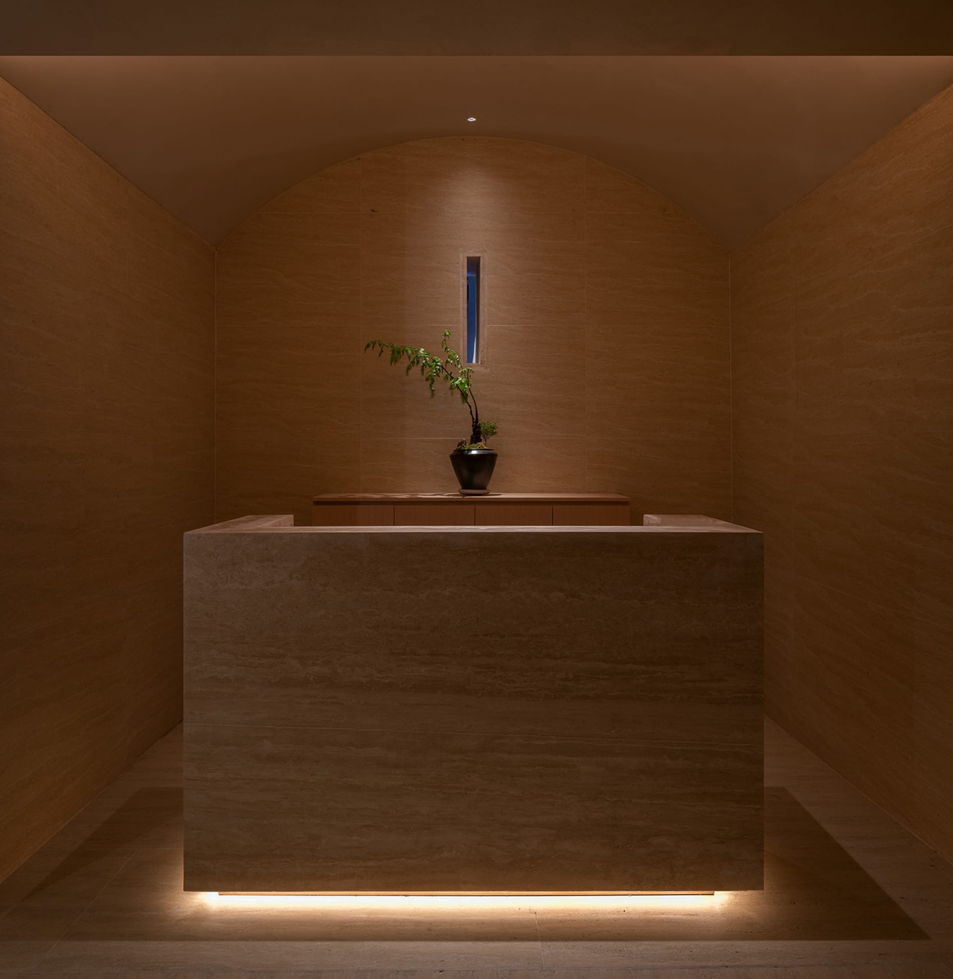 A photo of a modern reception desk made of marble.