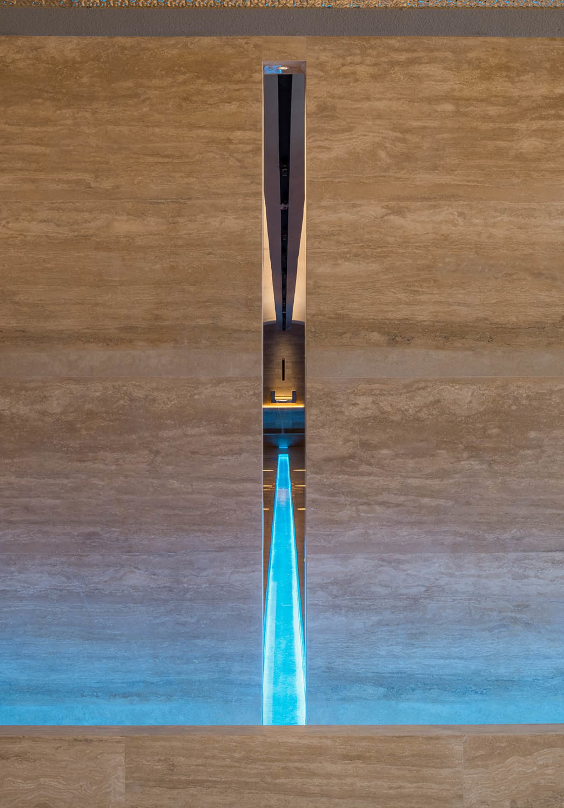 Modern swimming pool with blue light and wooden walls
