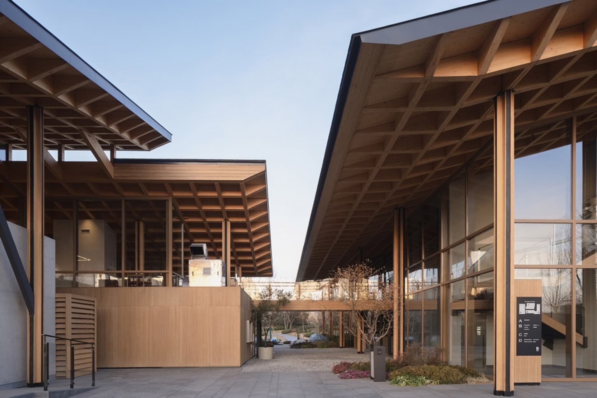 Modern commercial office space featuring wood and glass materials.