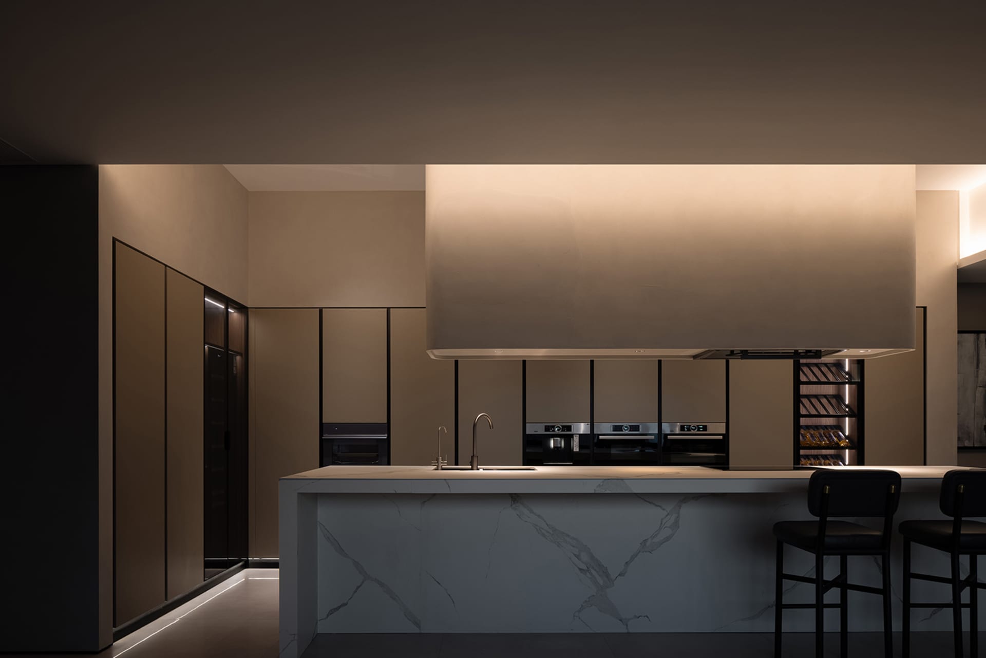 Modern kitchen featuring marble countertops and minimalist design