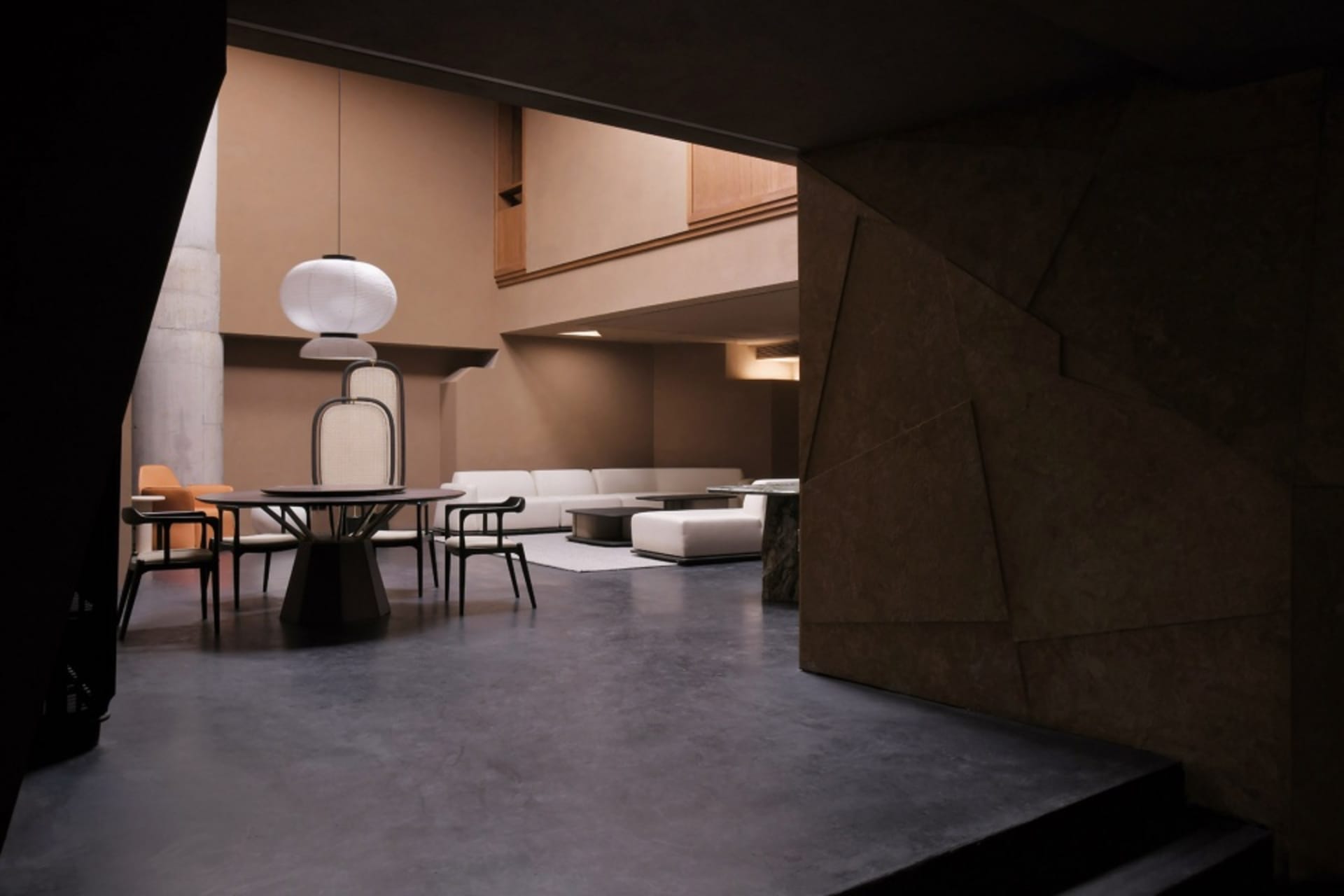 Modern living room with concrete flooring and minimalist design