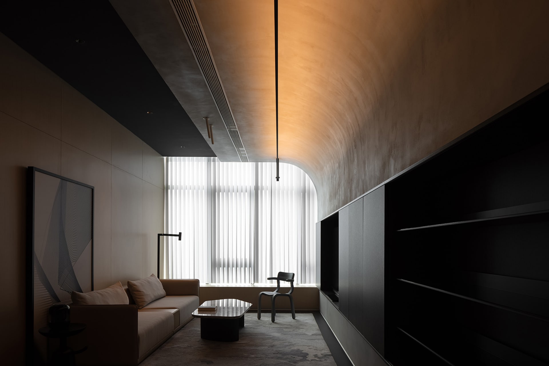 Modern living room featuring metallic furniture and glass elements.
