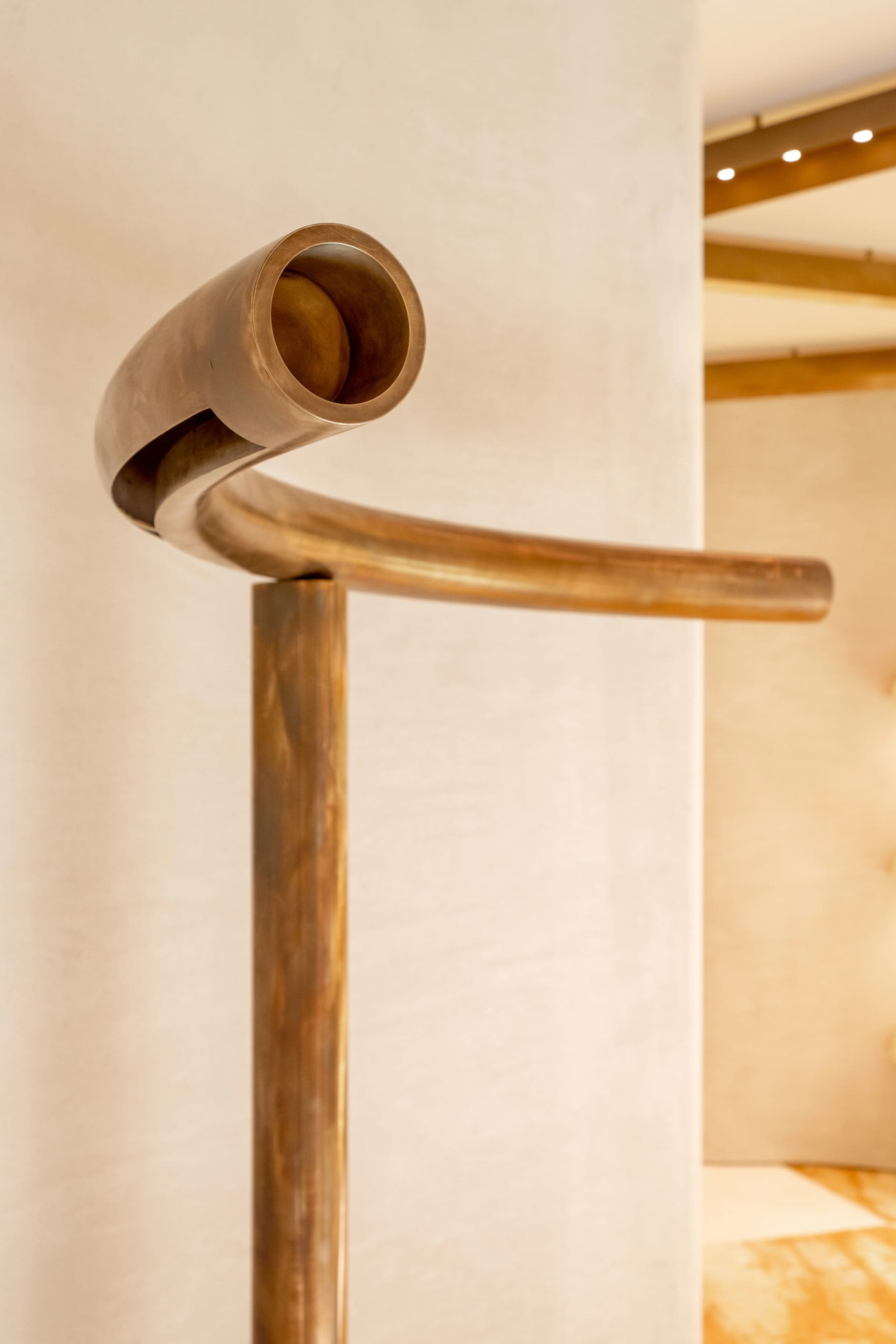 A modern, curved metal staircase with an elegant design.