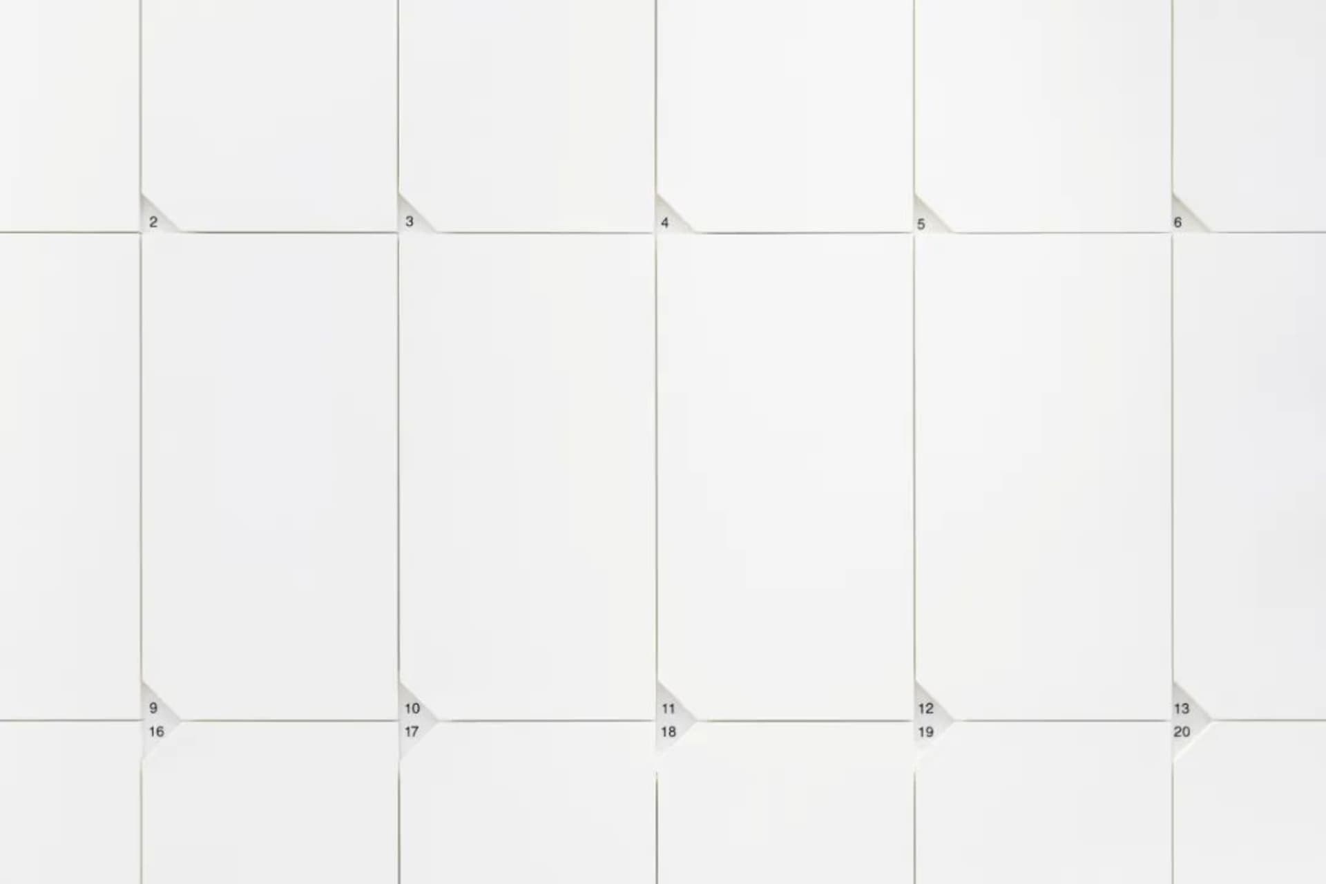 A modern calendar with a white paper design and a grid layout.