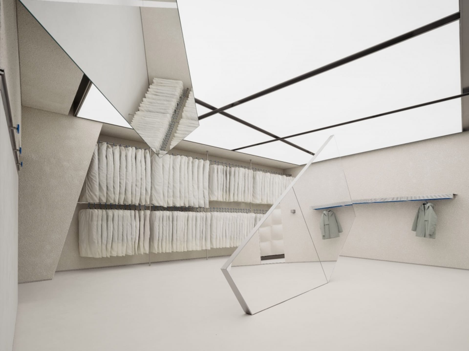Inside a modern clothing store with glass walls and ceiling, featuring dressing racks and shelves.