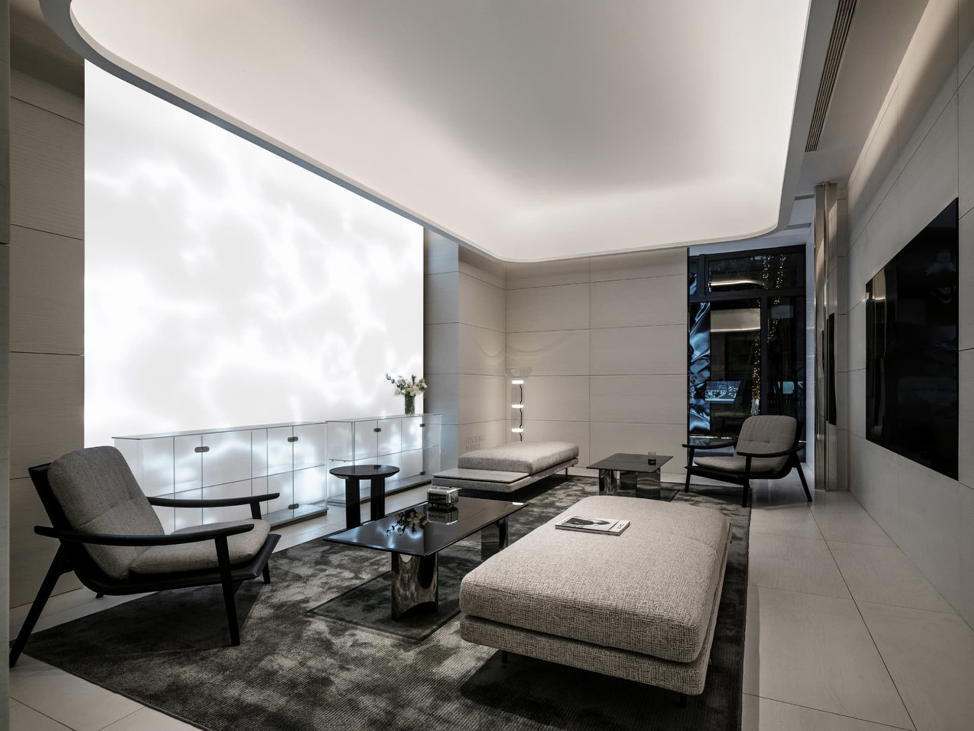 A modern minimalist living room featuring neutral-toned materials and a serene atmosphere.