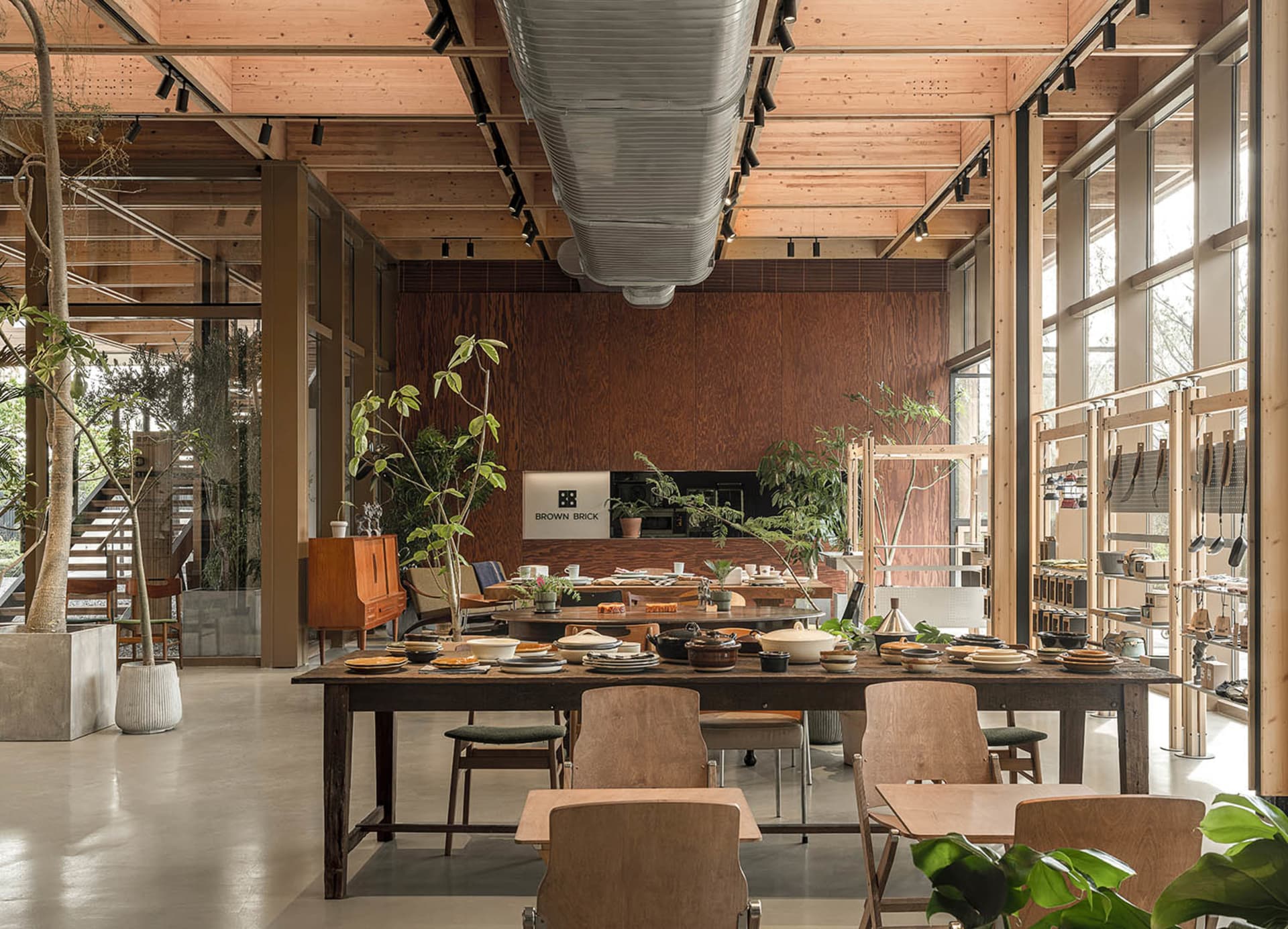 An industrial-style retail storefront featuring wooden materials and a spacious, open layout.