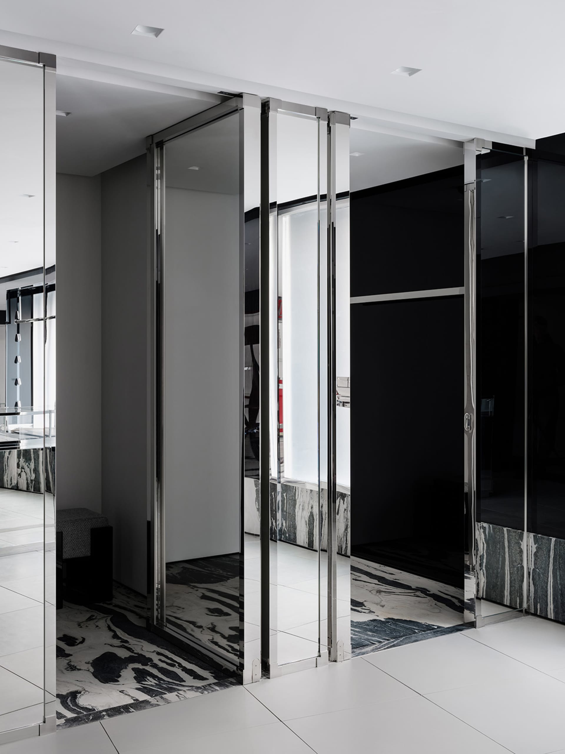 Modern office space featuring clear glass partitions