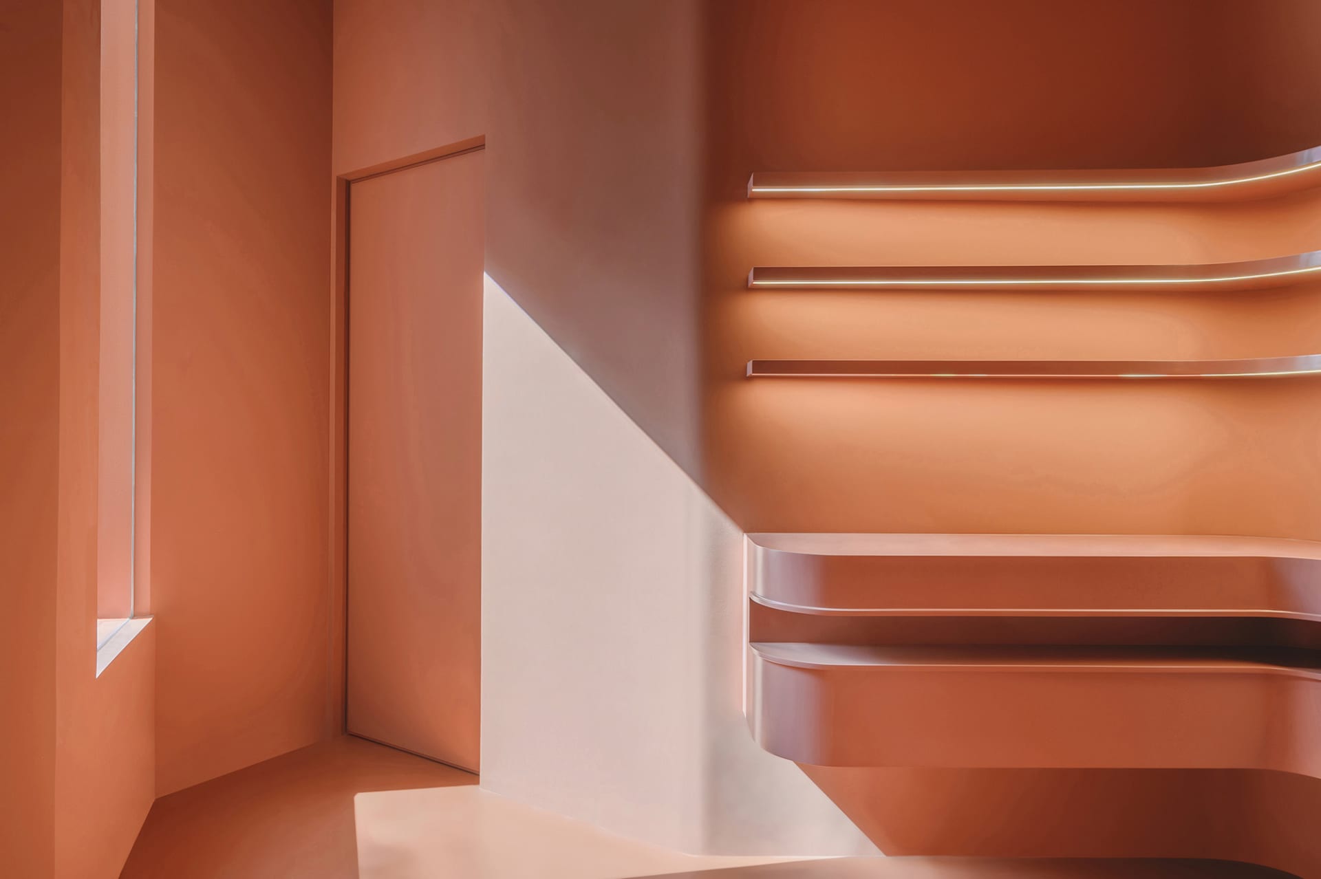 A modern staircase with metallic steps and handrails, featuring a sleek and contemporary design.