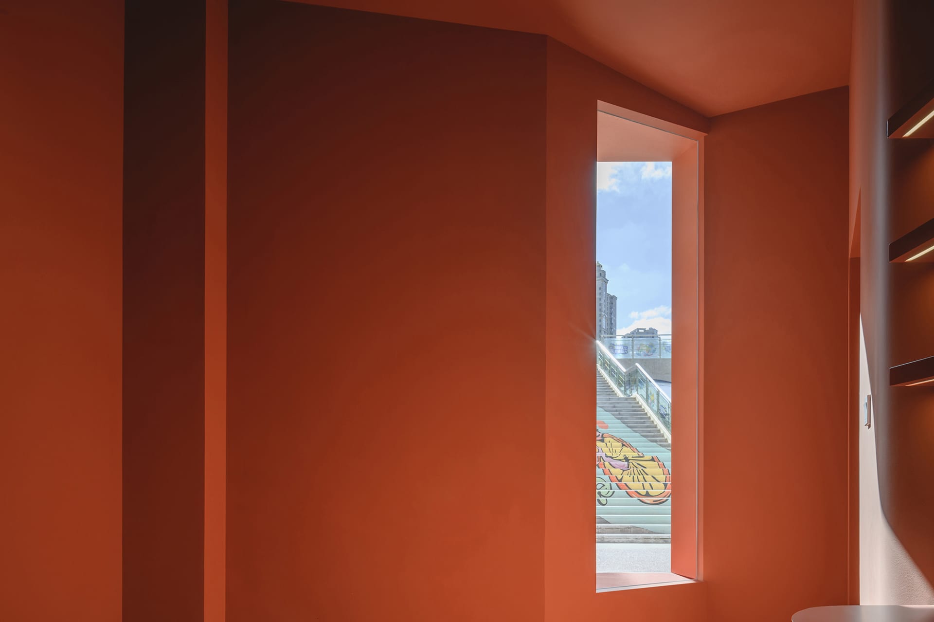 A window in a modern art gallery with colorful glass panels.