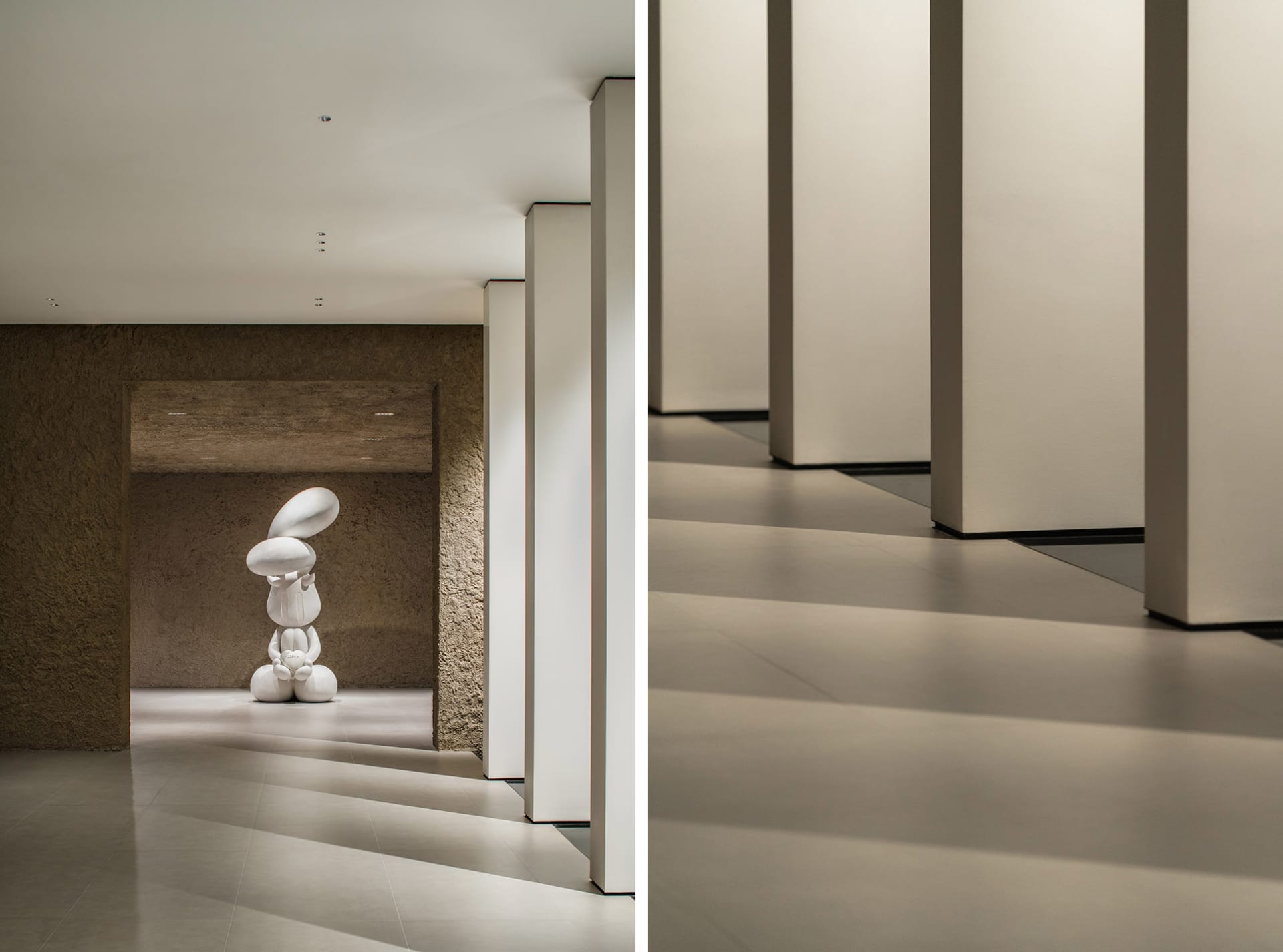 A modern interior space featuring a white concrete sculpture with abstract shapes.