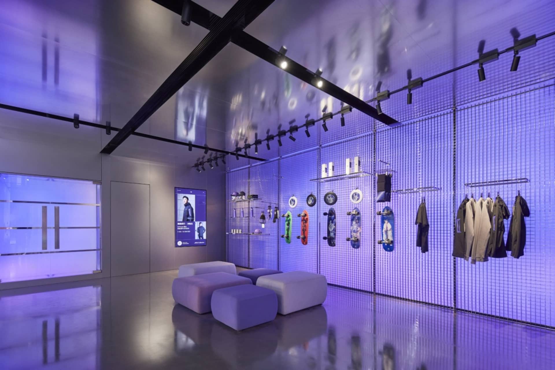A modern retail shop with a glass wall and metal accents.