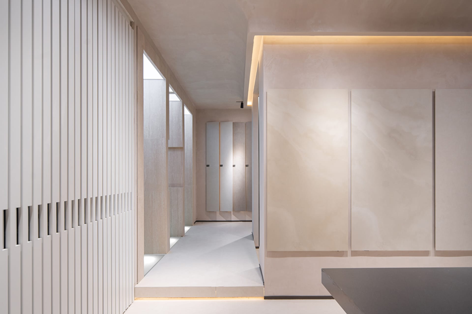 Minimalist interior space featuring concrete materials and industrial design elements