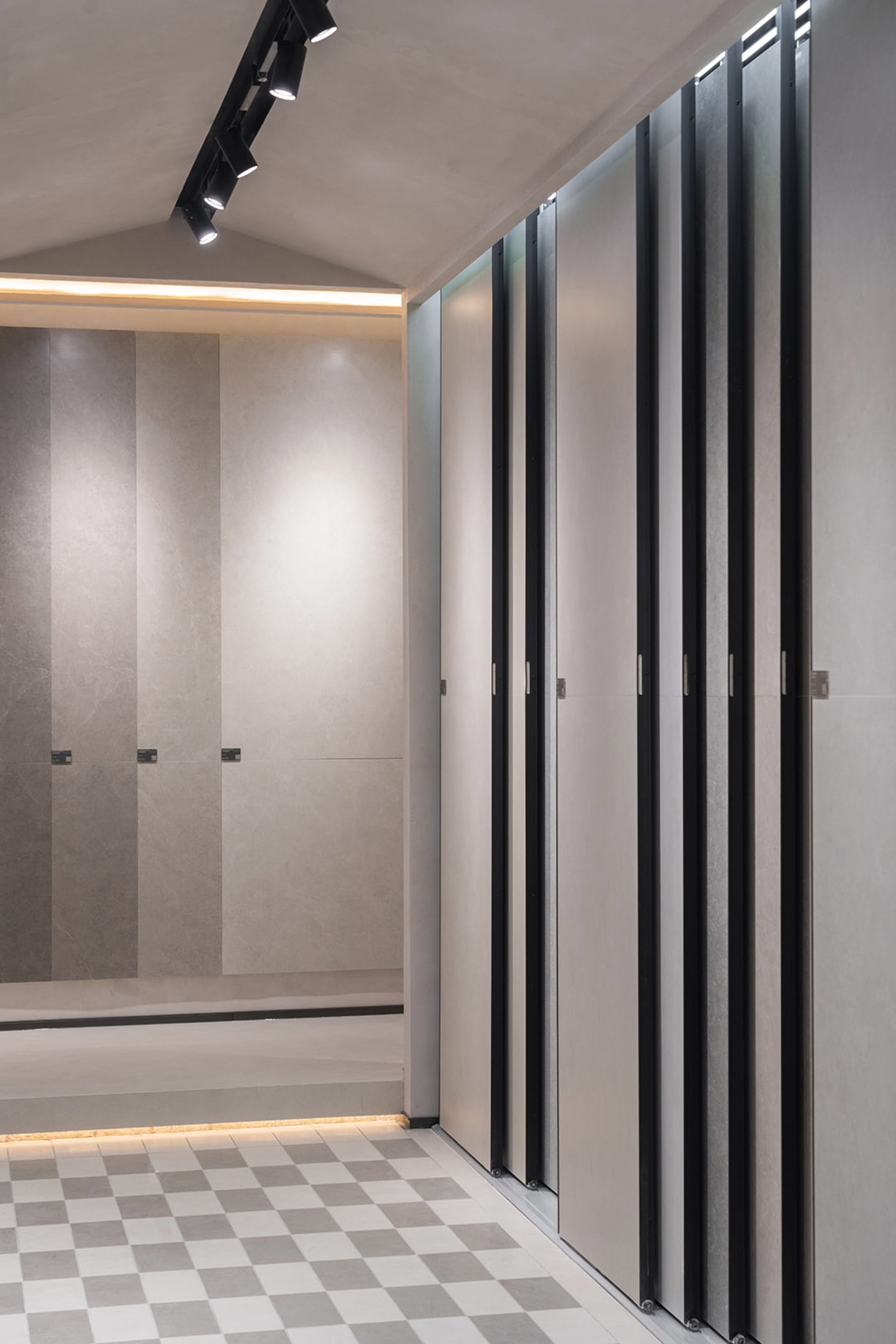Modern, minimalist retail store interior with concrete walls and floors.