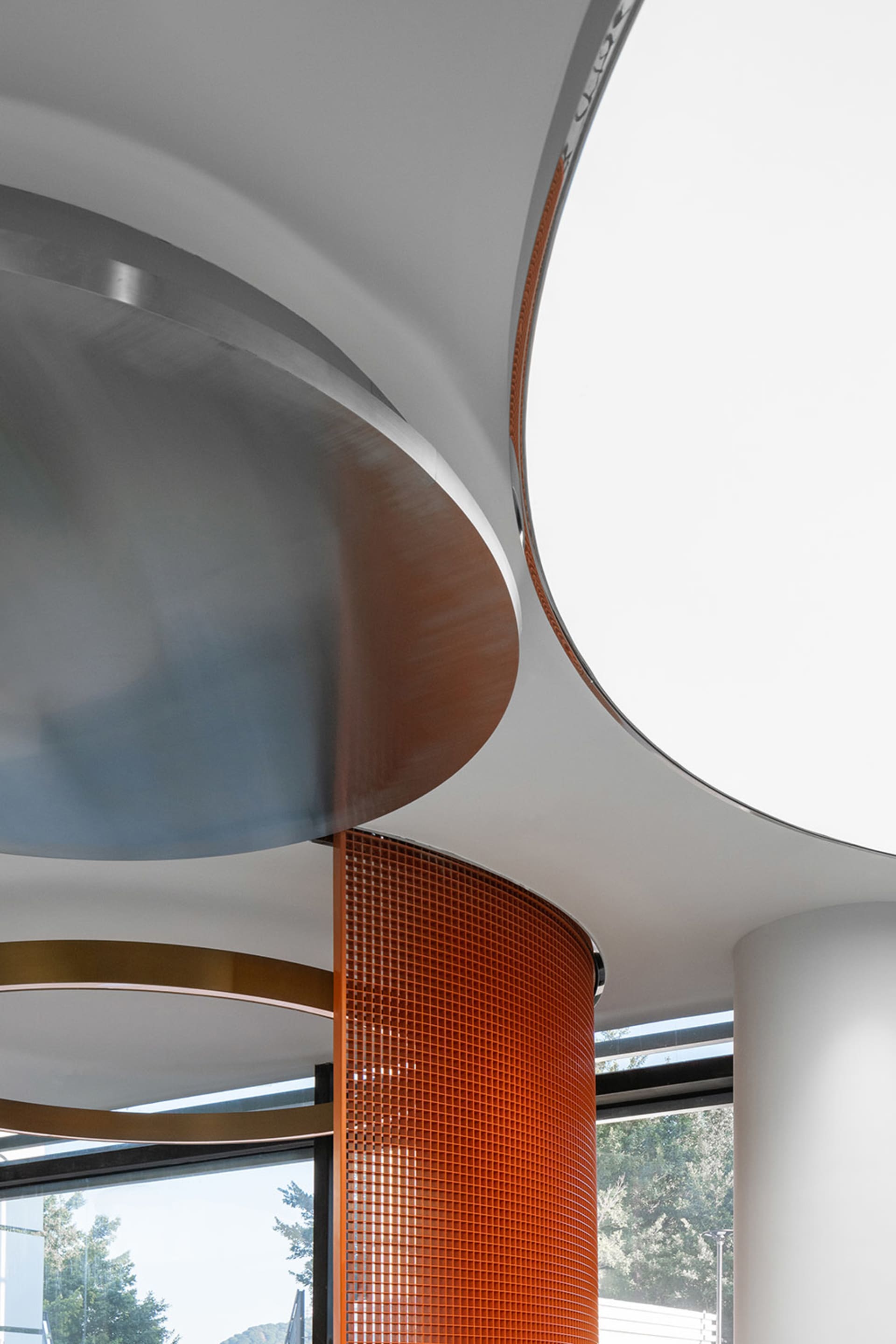 A modern interior design space showcasing mixed materials such as metal and glass.