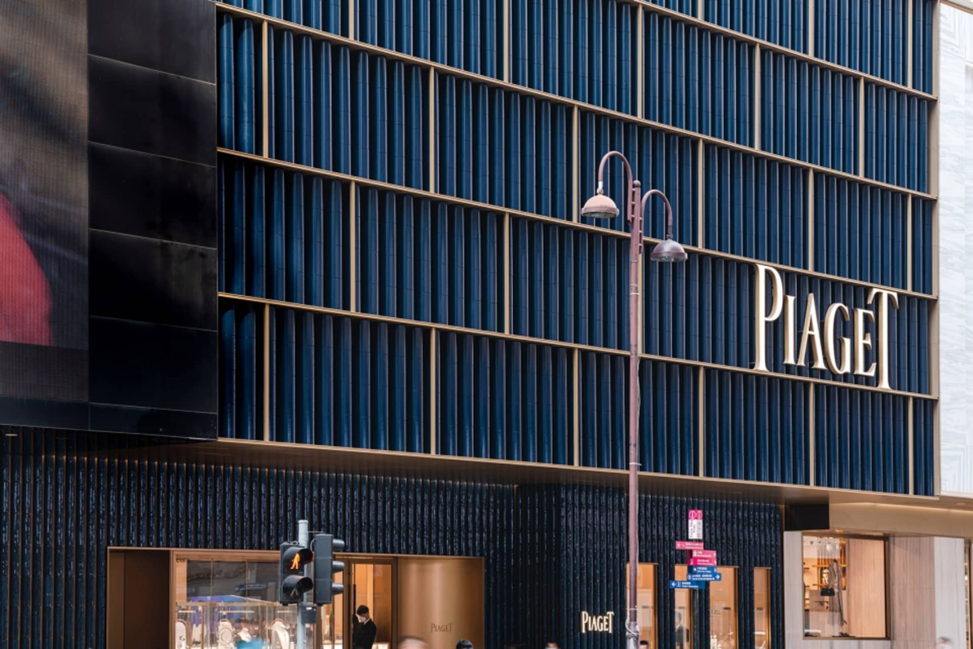 Modern storefront with metal, glass, and stone materials