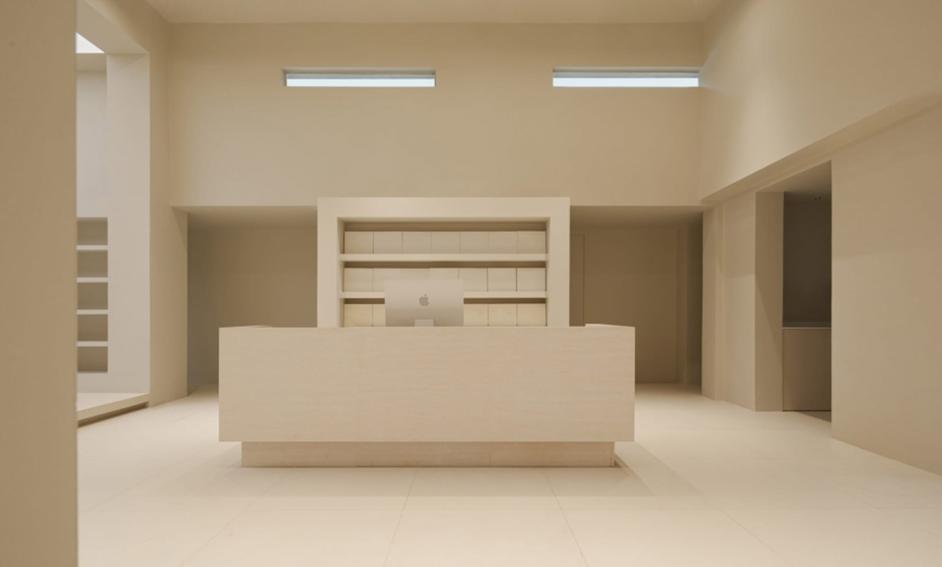 A minimalist reception desk made of stone.
