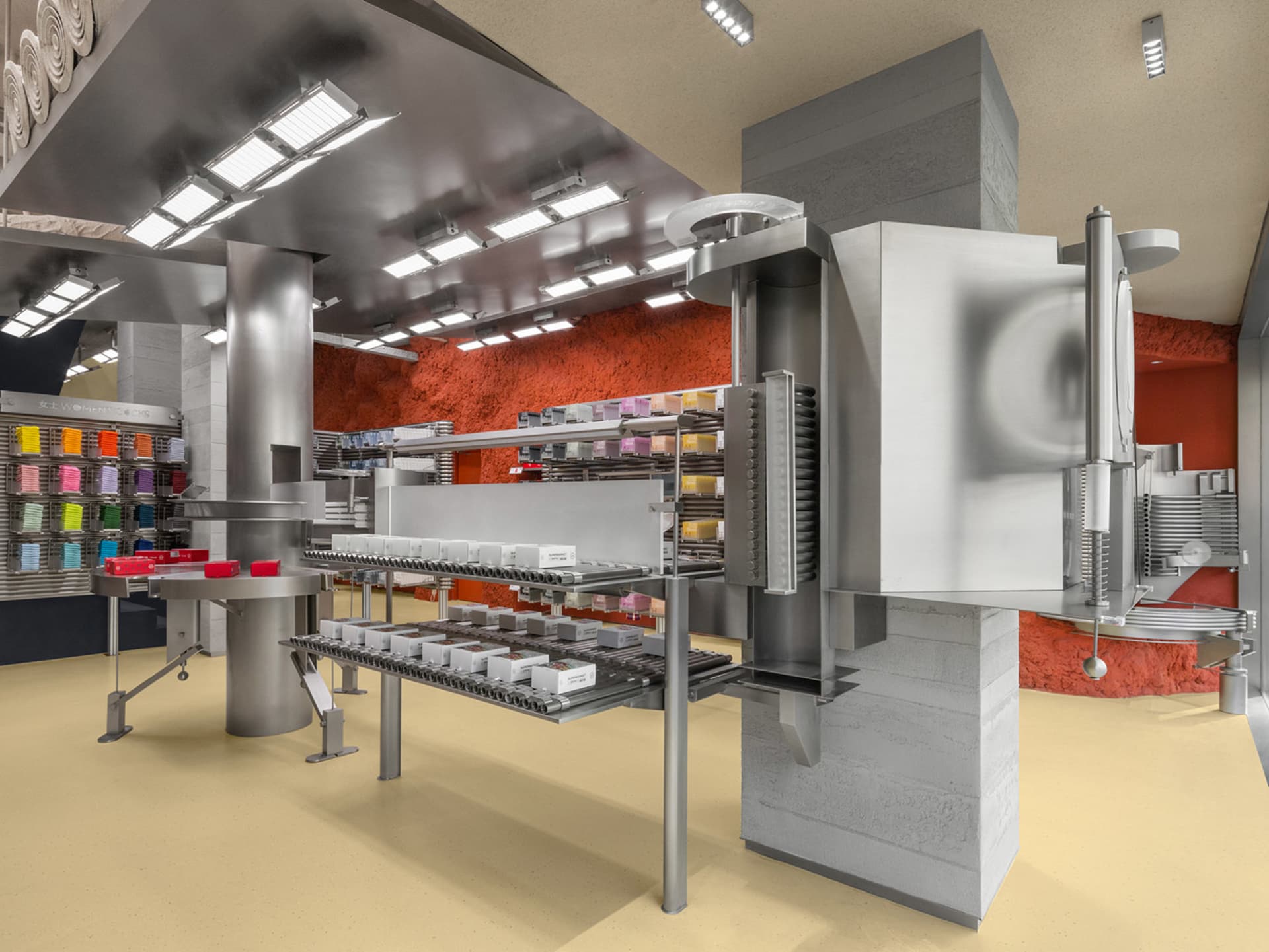 An industrial retail space with metallic features and organized product displays.