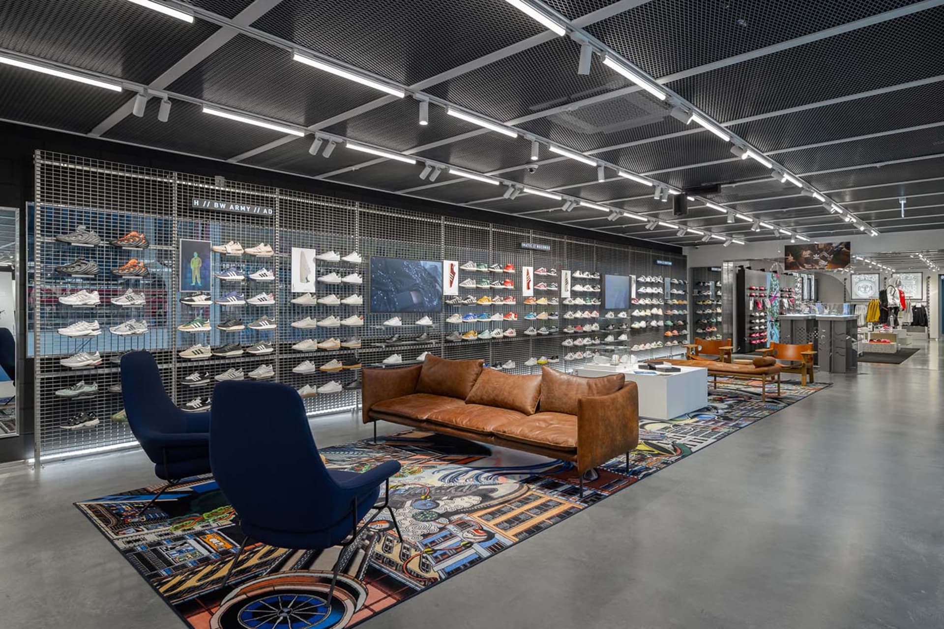 A retail shoe store with a modern, industrial design featuring metal displays.